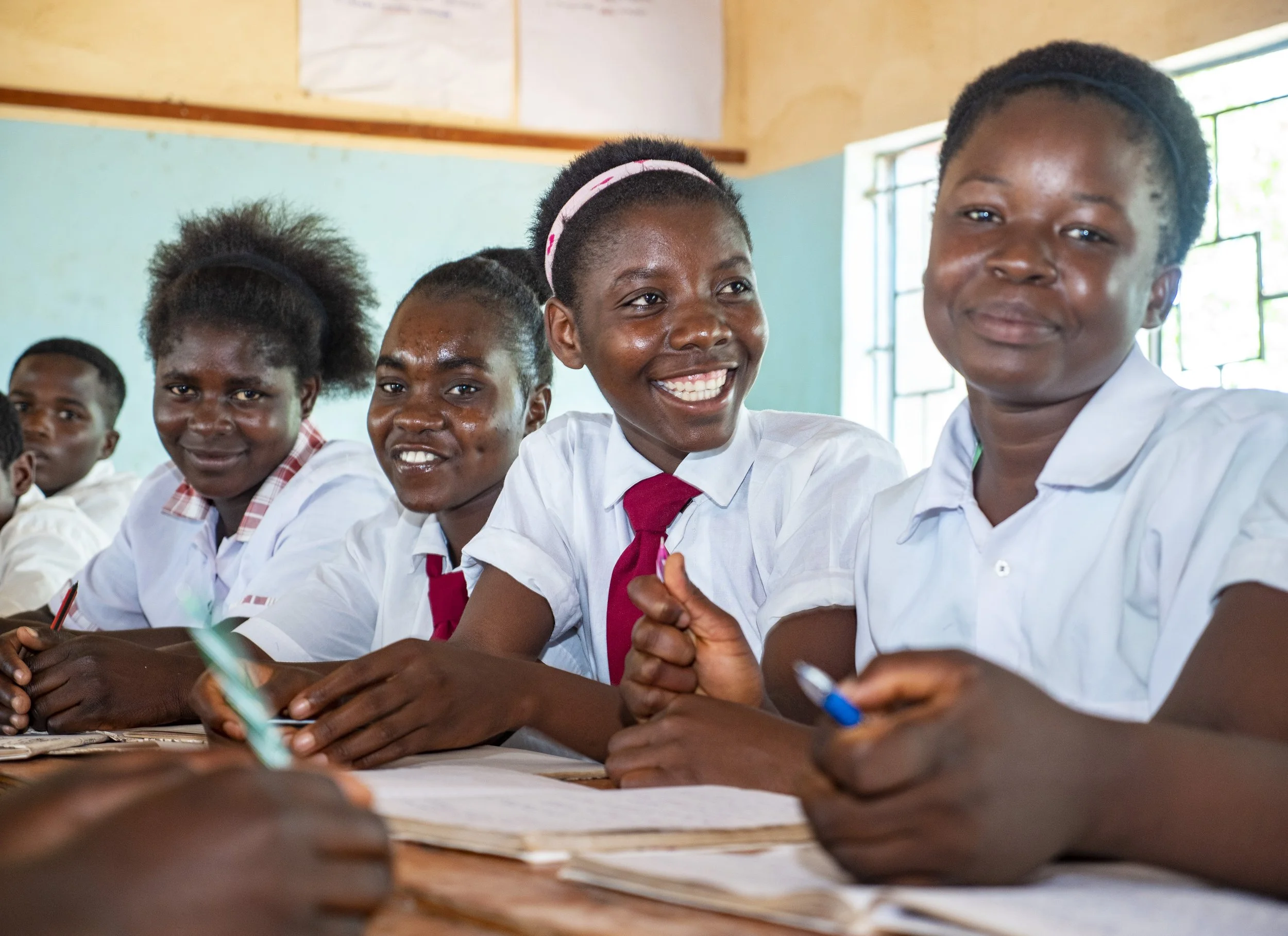Girls learning together in classroom, empowered through education, Zambia