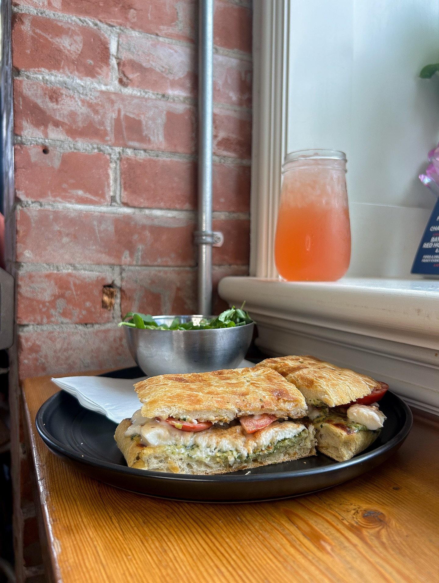 Introducing Our New Feature Sammy! 
The Italian Caprese is BACK🇮🇹😍 
Rosemary Fococcia Bread With Tomato, Fresh Mozzarella, Pesto, Aoli and Balsamic Glaze! 

Also Pictured: Our New Steeped Iced Tea Feature- White Peach and Bluberry Lemon Jasmine Ic