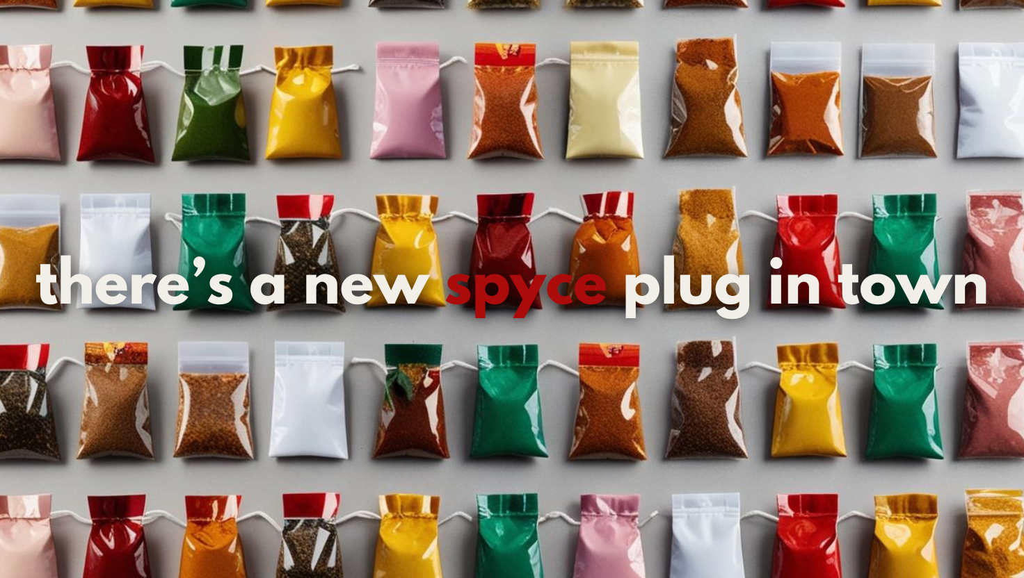 Multiple small colorful spice packets arranged in rows on a white surface with the text 'there’s a new spYce plug in town' overlayed.