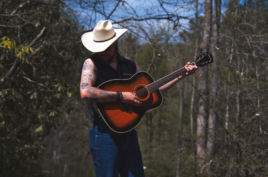 Tuskhead with guitar.png