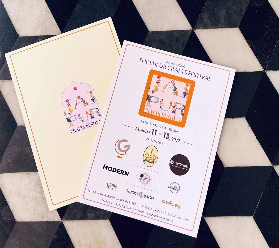Jaipur Crafts Festival promotional flyers on geometric patterned surface