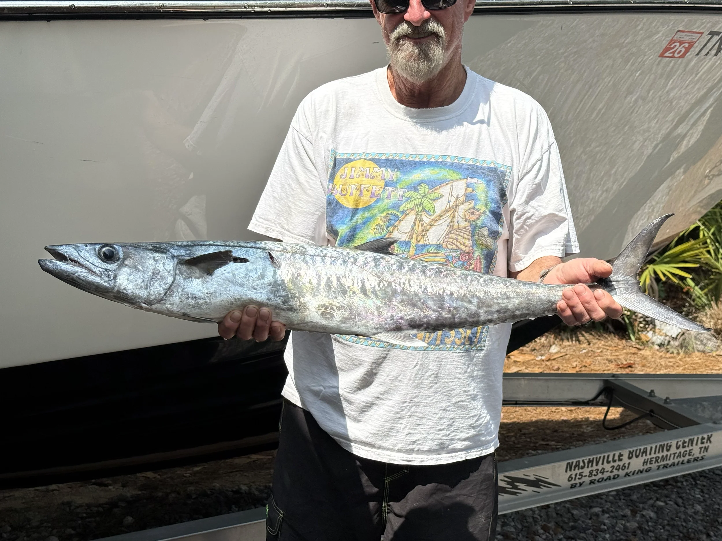 Man holding King Mackerel caught in the Gulf