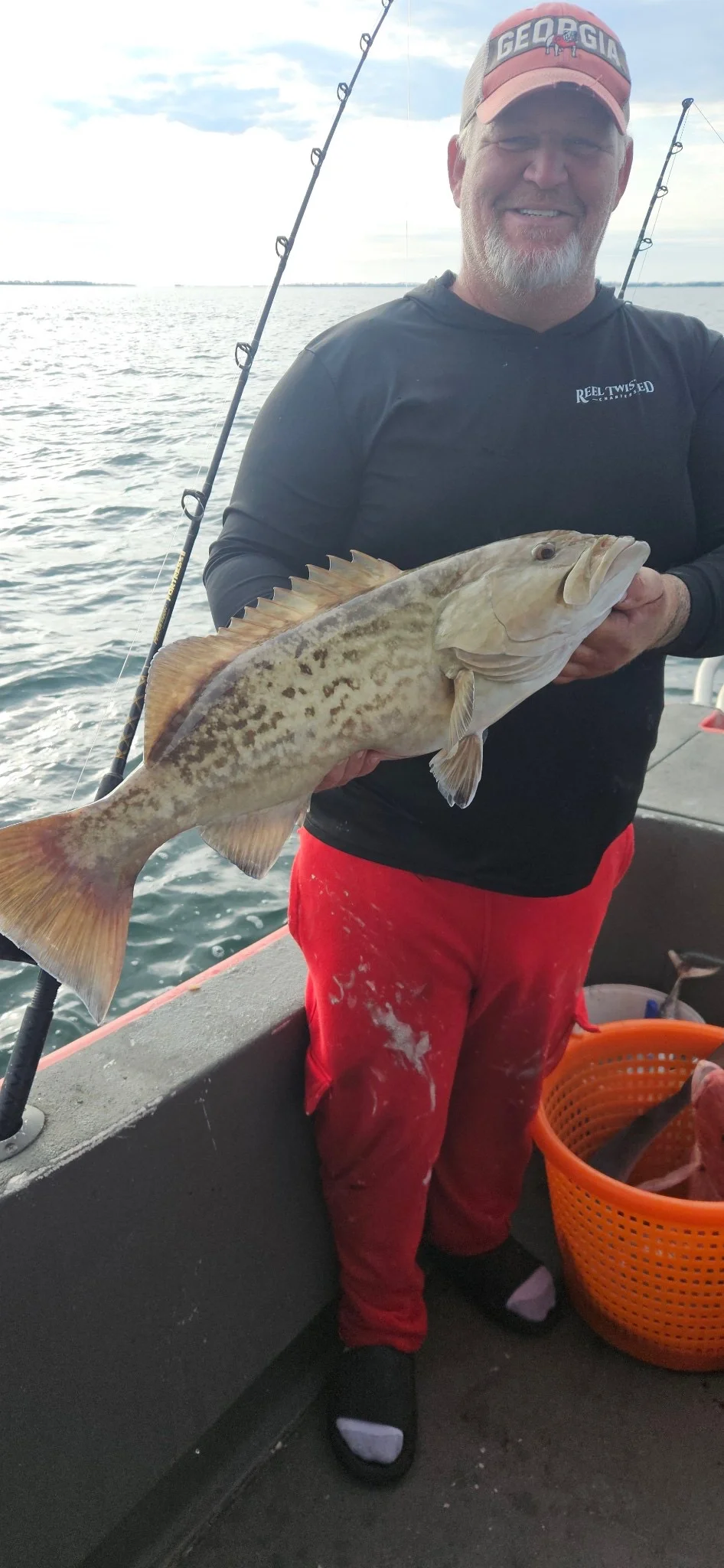Man holding up his Gulf catch