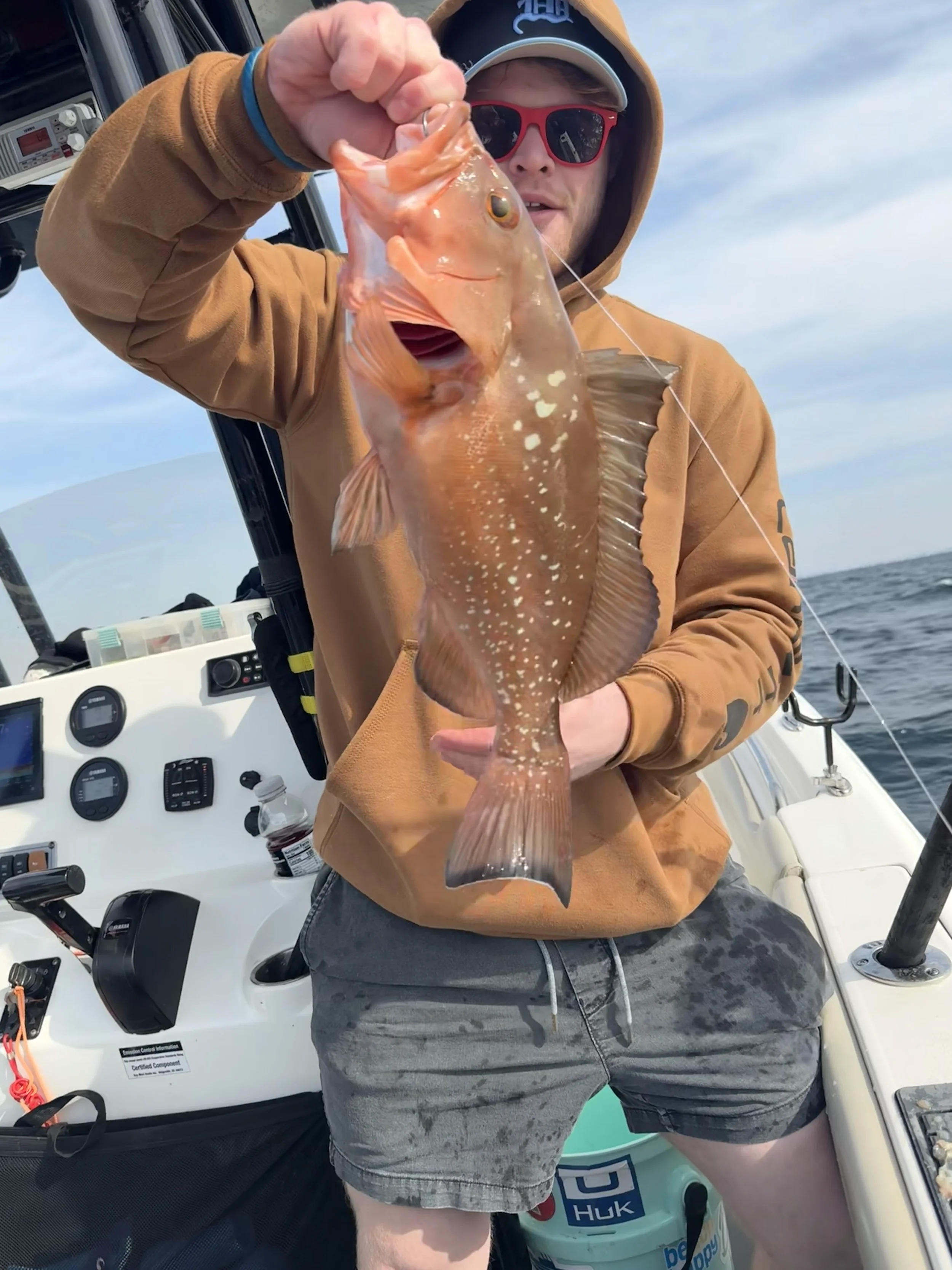 Man holding up a red Snapper in the Gulf