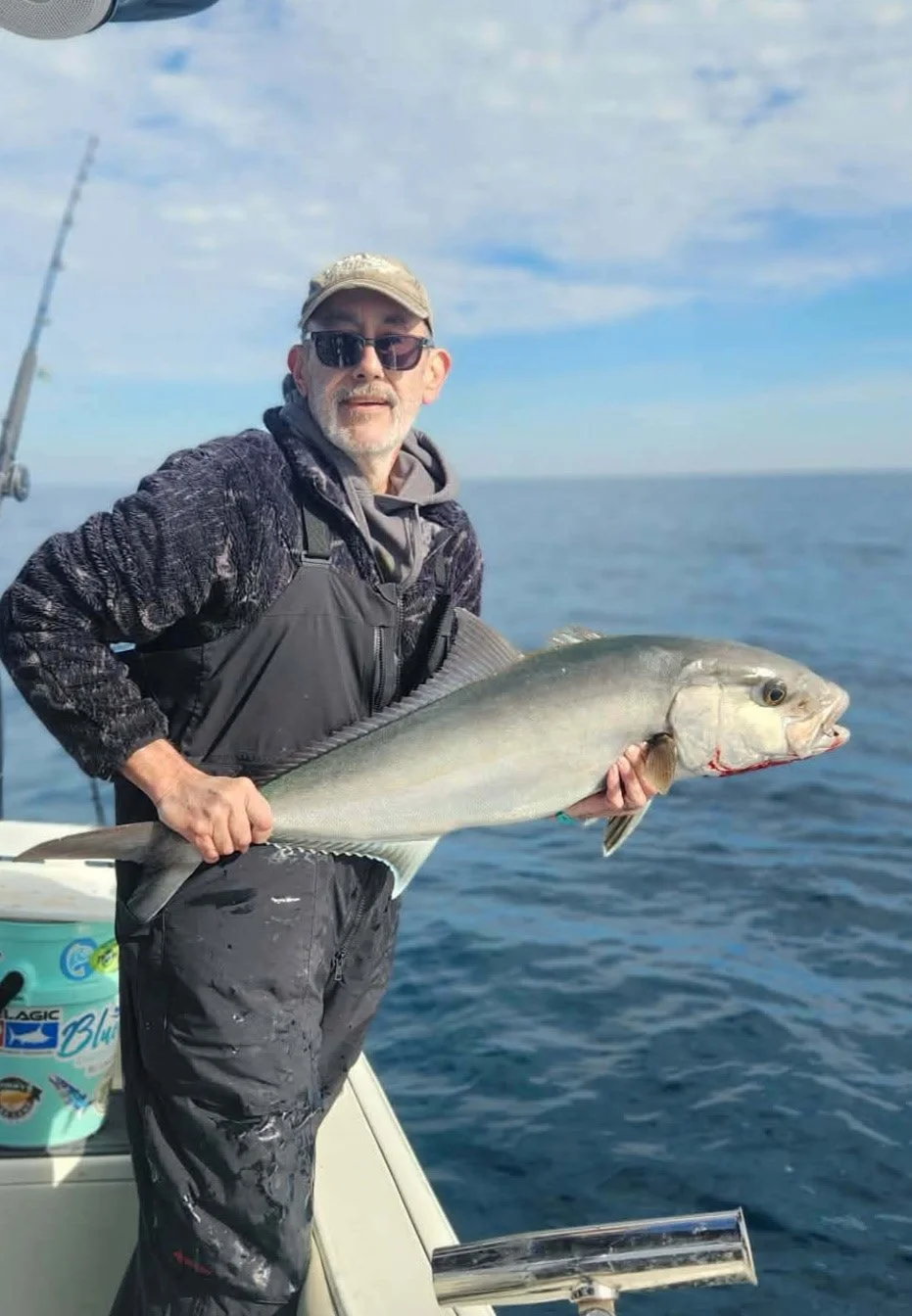 Man holding his Gulf fish on a boat