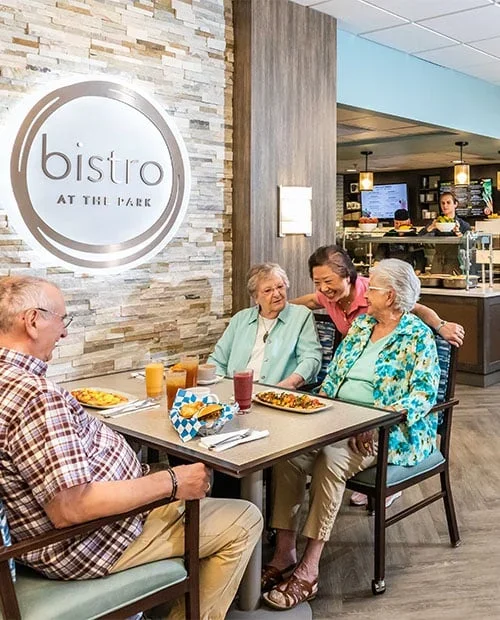 Active seniors enjoying social time in an independent living community in Oregon, designed for older adults seeking maintenance-free senior housing and community amenities.