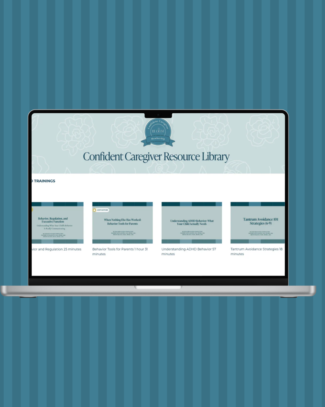 Open laptop displaying the Confident Caregiver Resource Library website, featuring various training modules on caregiving topics, with a blue floral background.