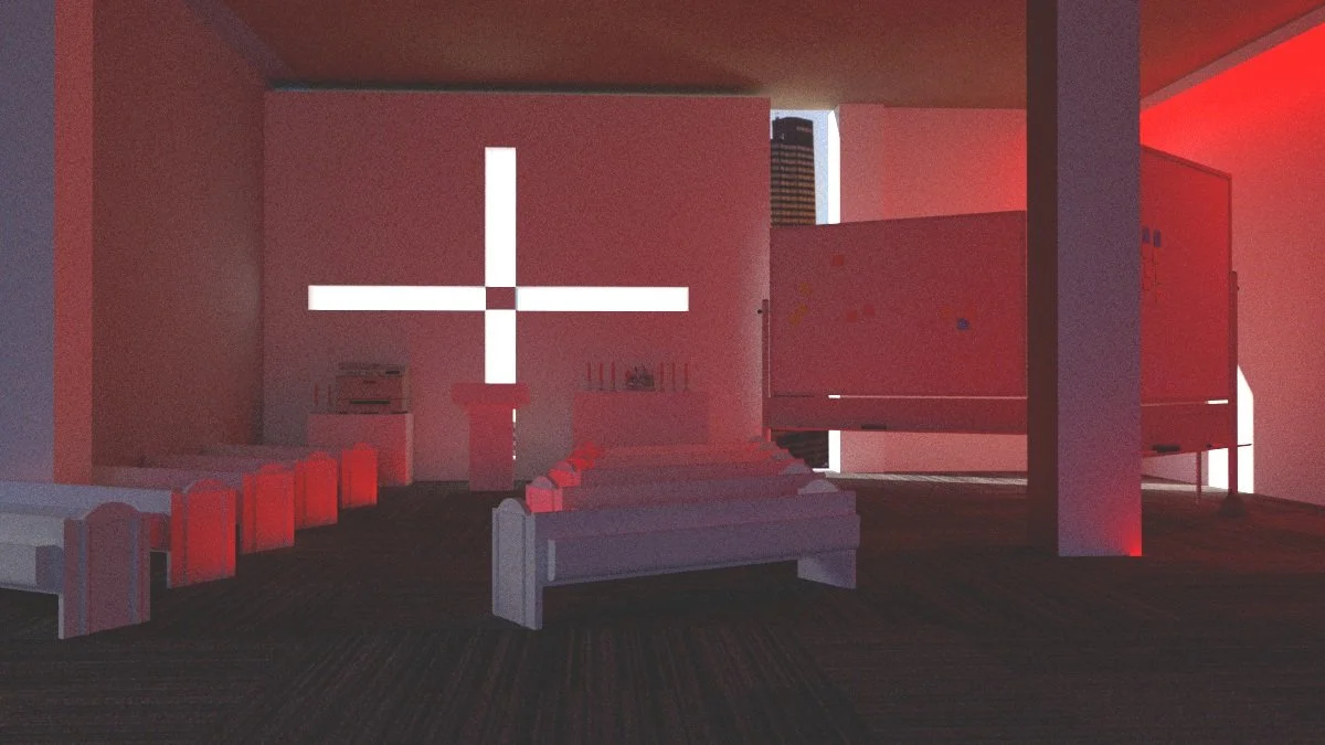 Interior of modern chapel with red lighting, featuring a large cross on the wall and rows of benches.