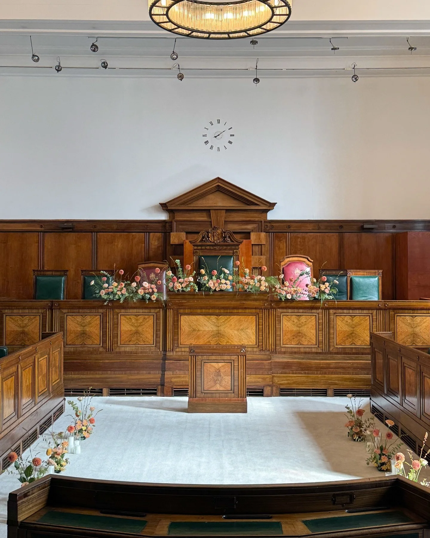 Floral arrangements for the ceremony space.

Soft peach and blush tones
designed to complement the warmth of the room.

Thank you R&amp;G for trusting us with your wedding flowers 🧡

Venue @townhallhotel 

#Roha_wedding