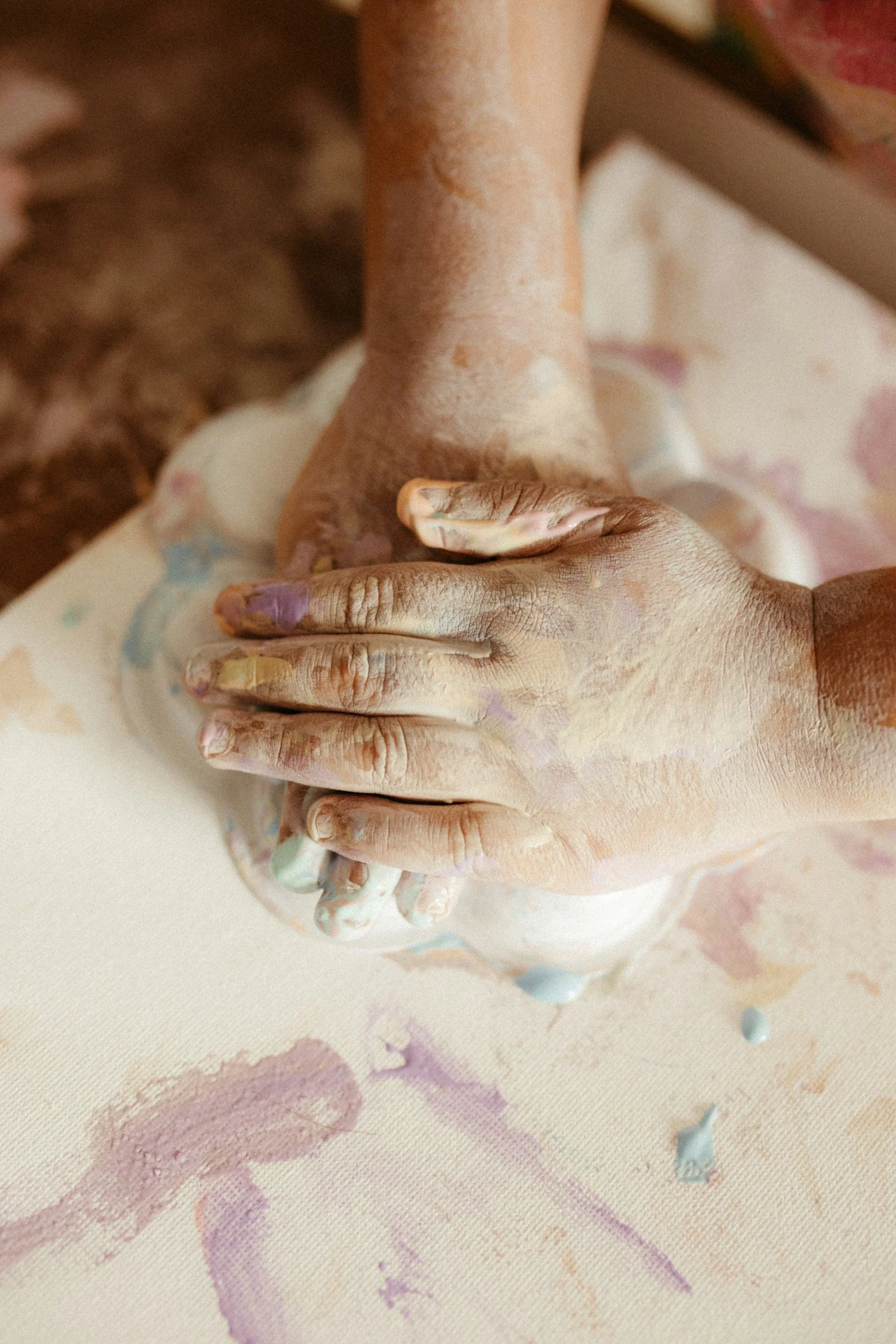 A child engaging in an expressive art intervention during a play therapy session.