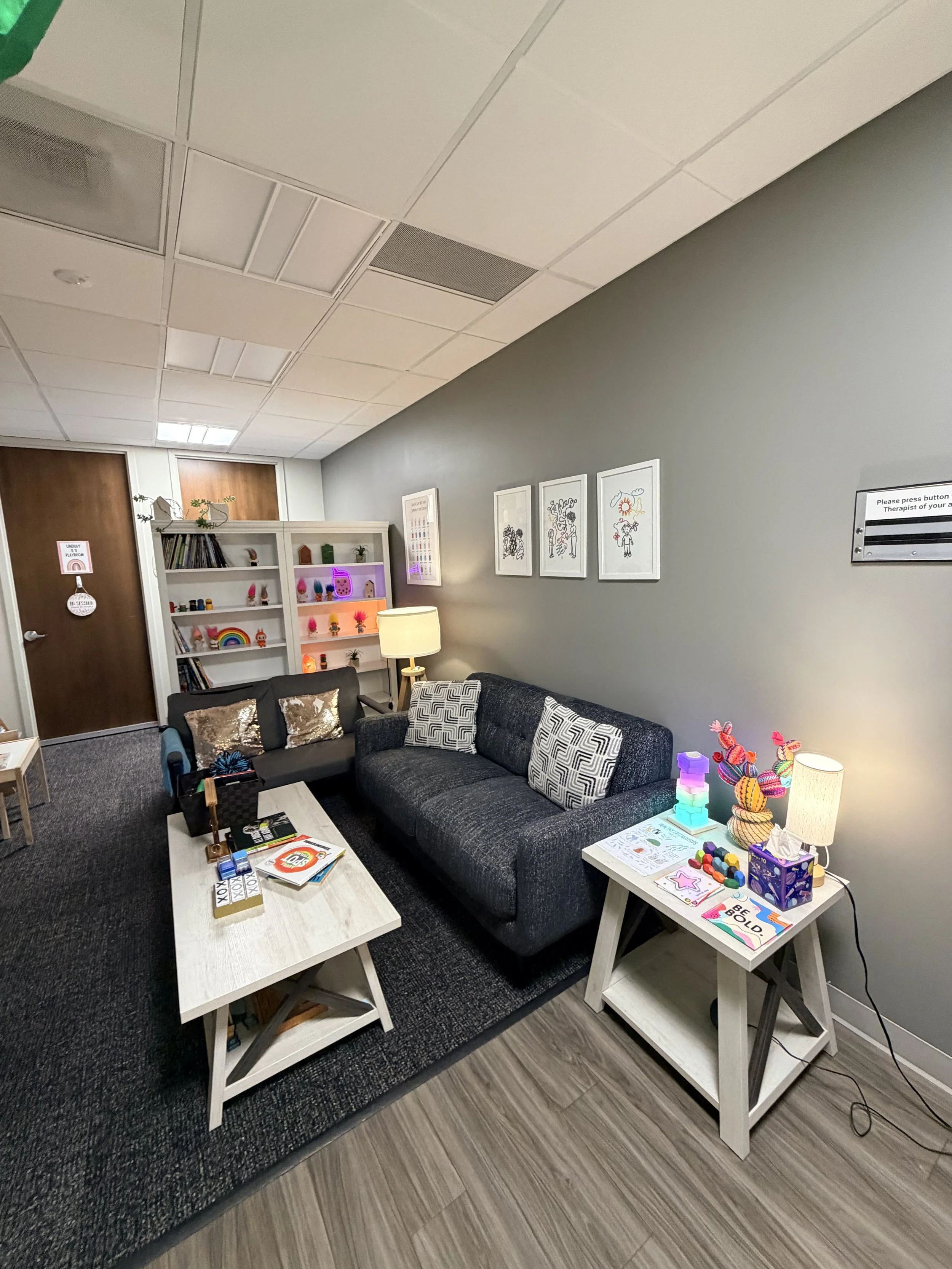 A picture of a waiting room of a play therapist's office. Children and teens attend here to address mental health challenges.