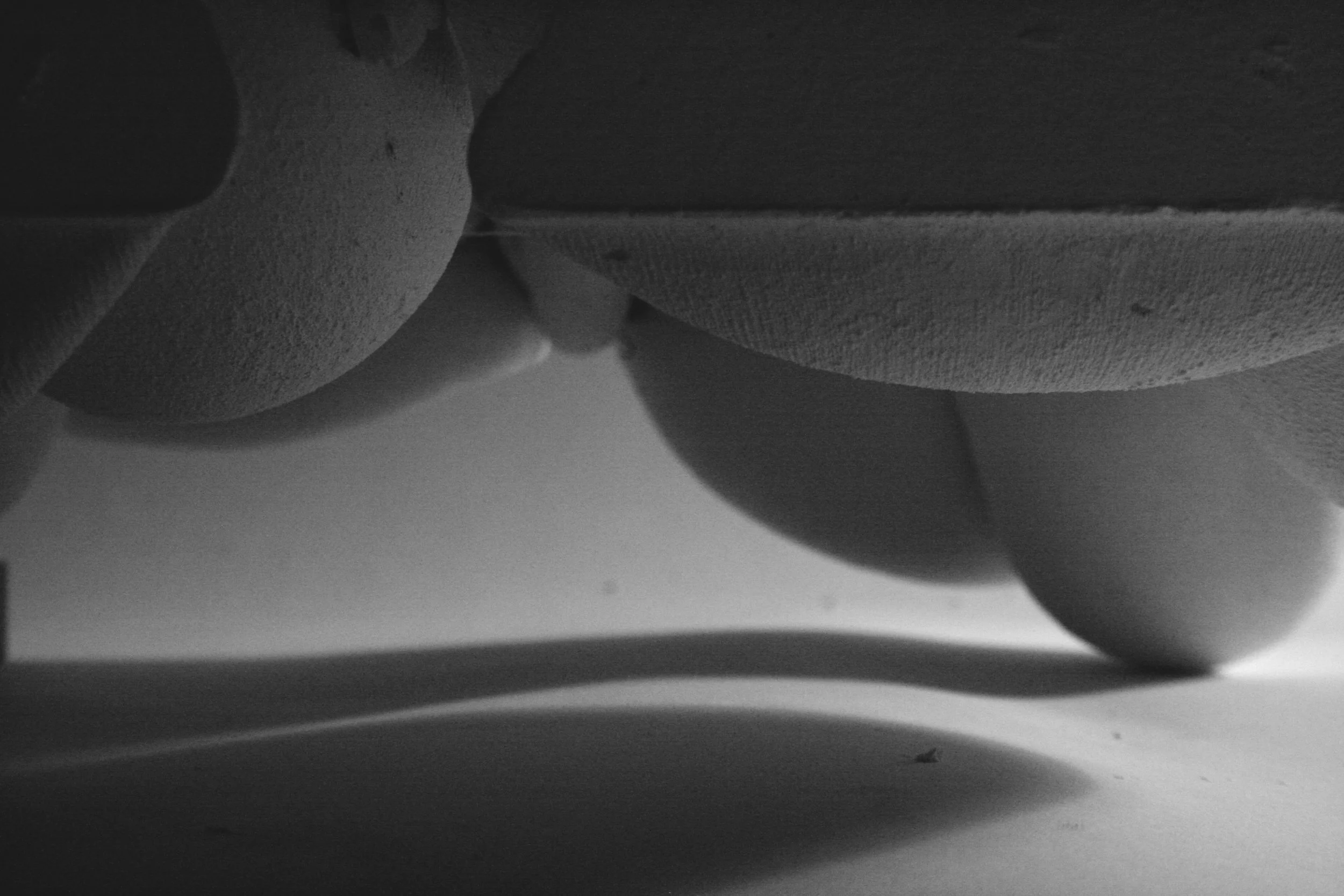 Detail of a plaster object cast in fabric with curved shapes