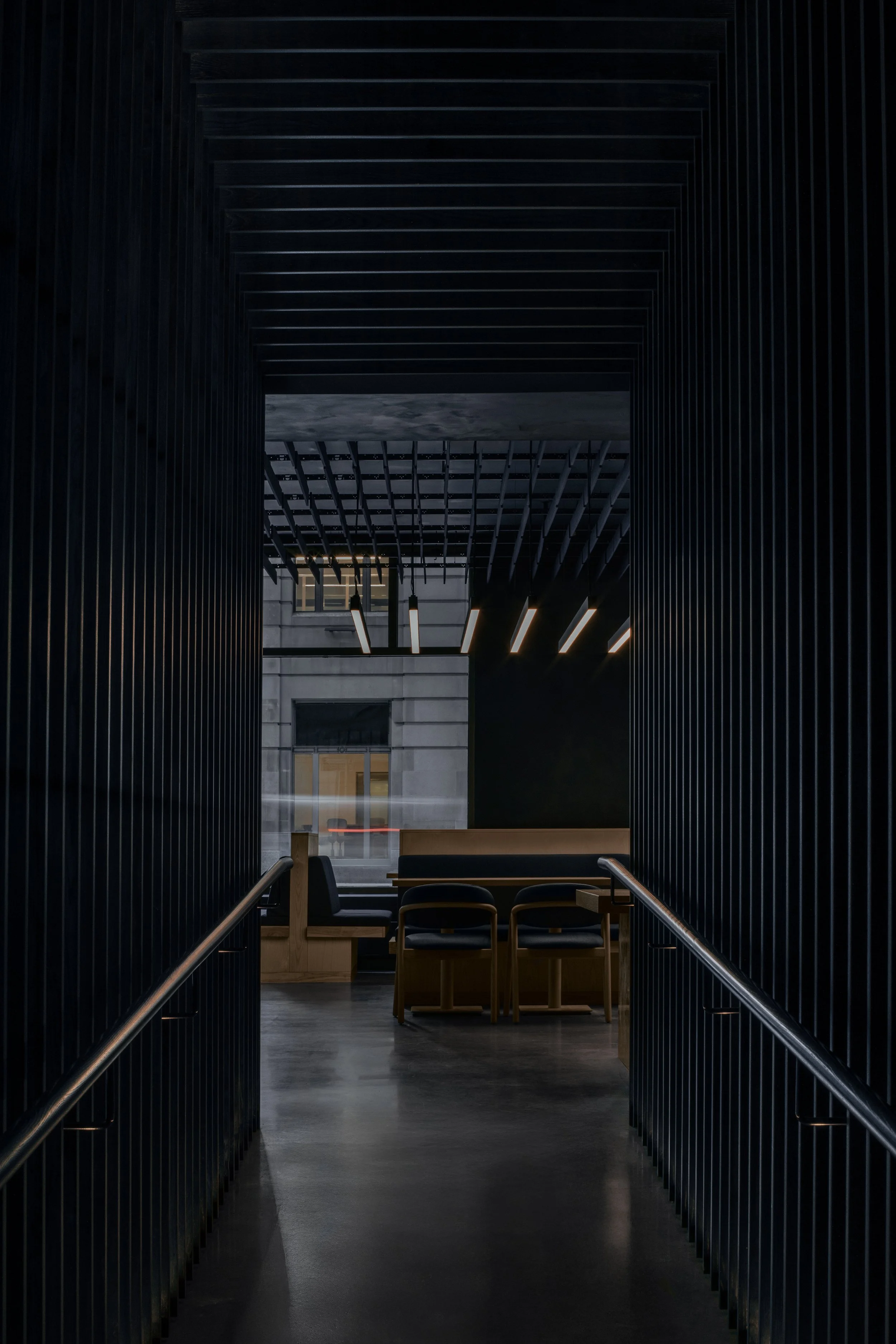 Blue-stained wood screen entrance tunnel of Japanese restaurant
