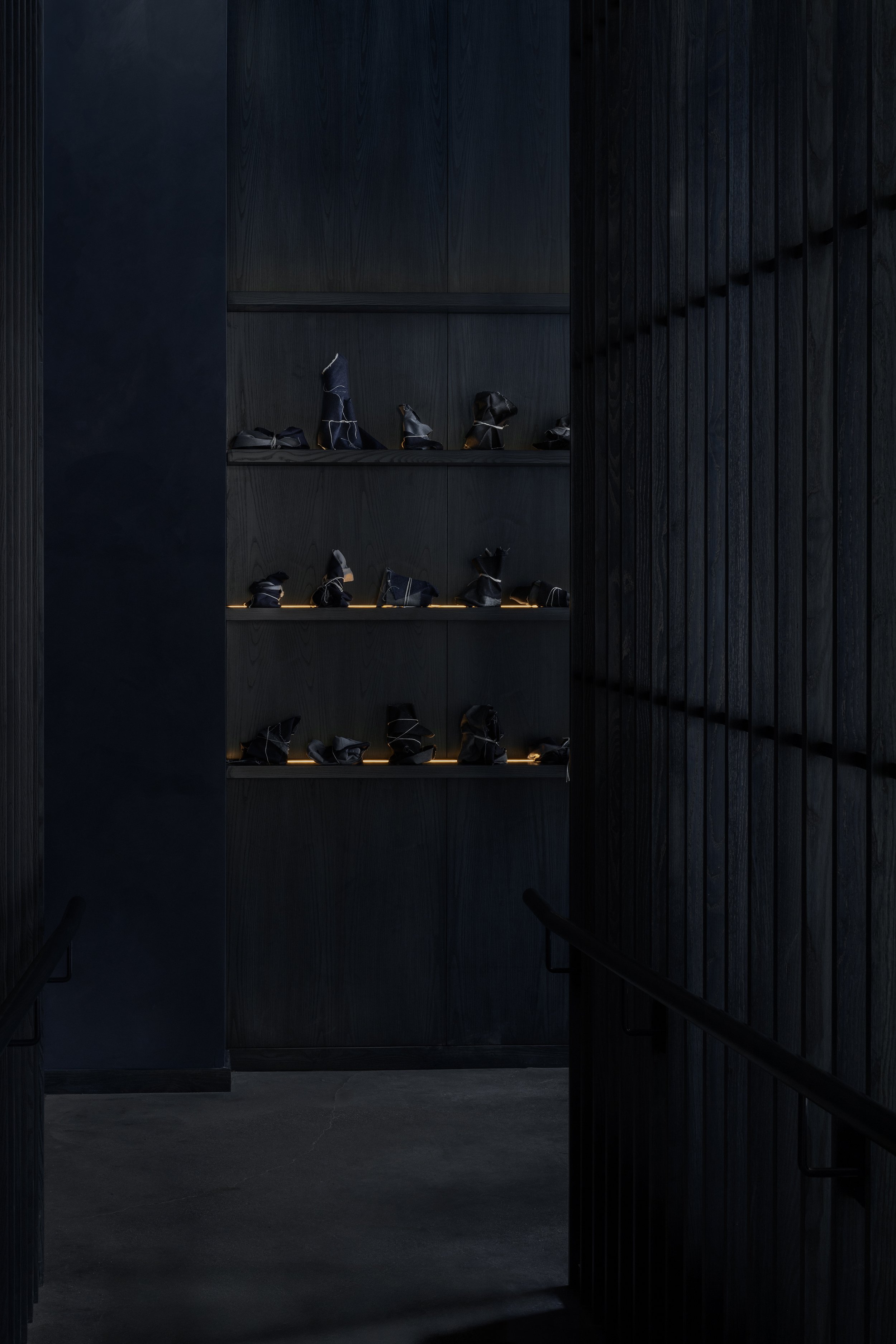 Blue-stained wood shelving and wood screen