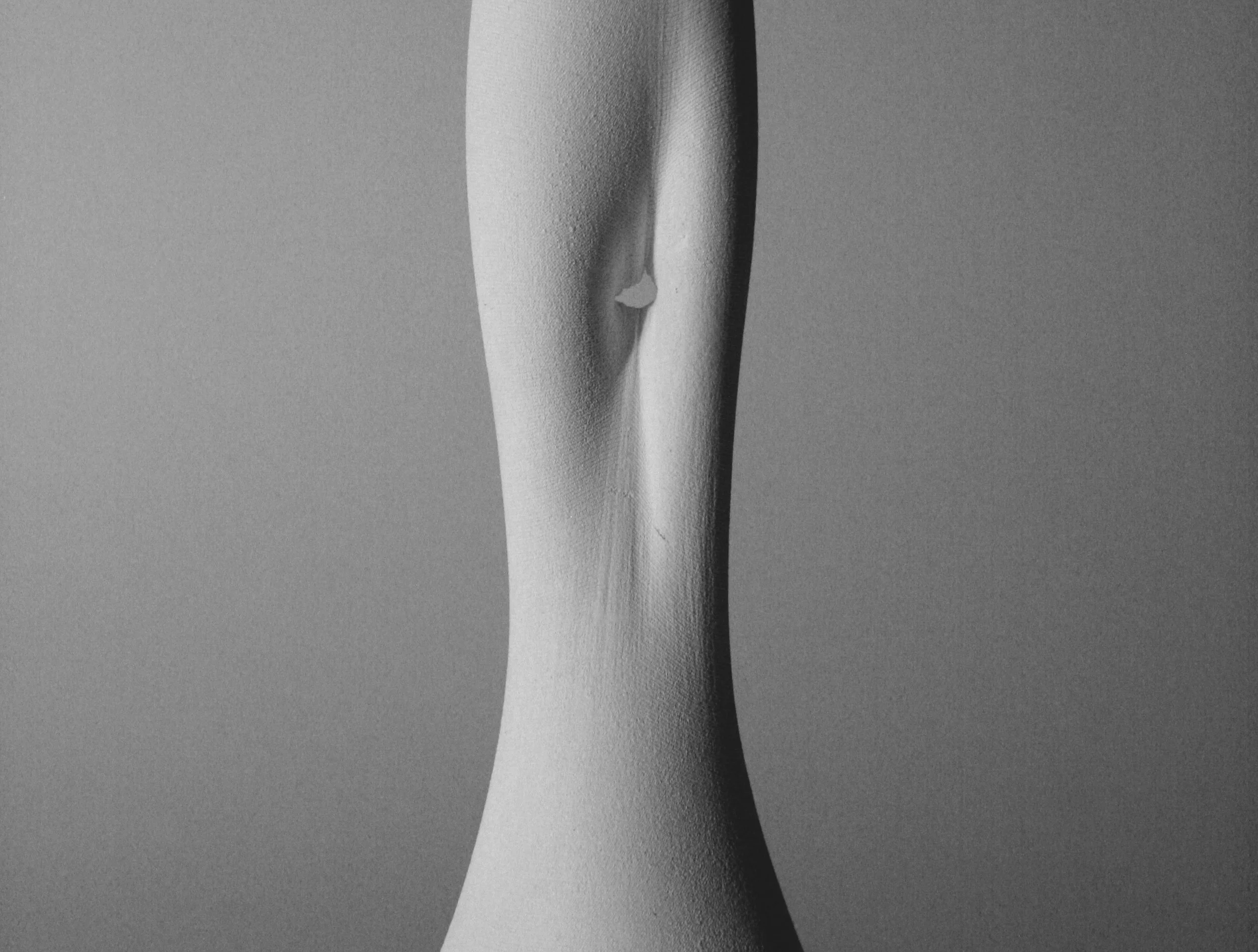 Detail of curved, textured sculpture made using fabric formwork