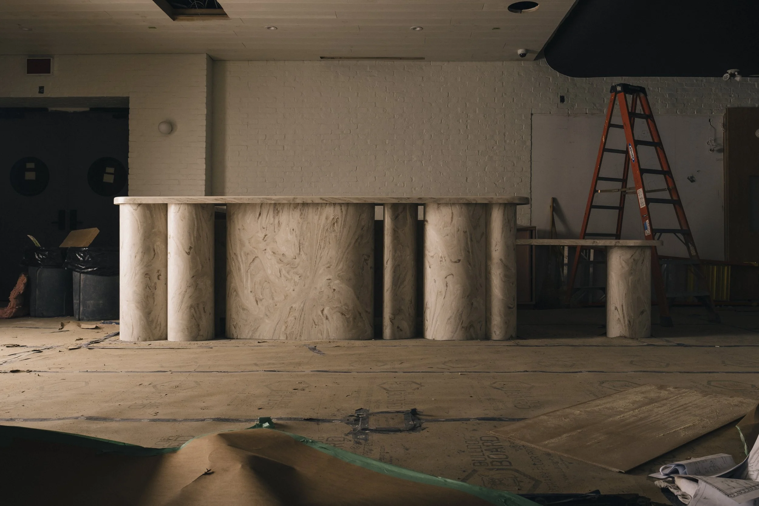 Sculptural reception desk made of Corian and designed by Odami for The Drake Hotel in Toronto