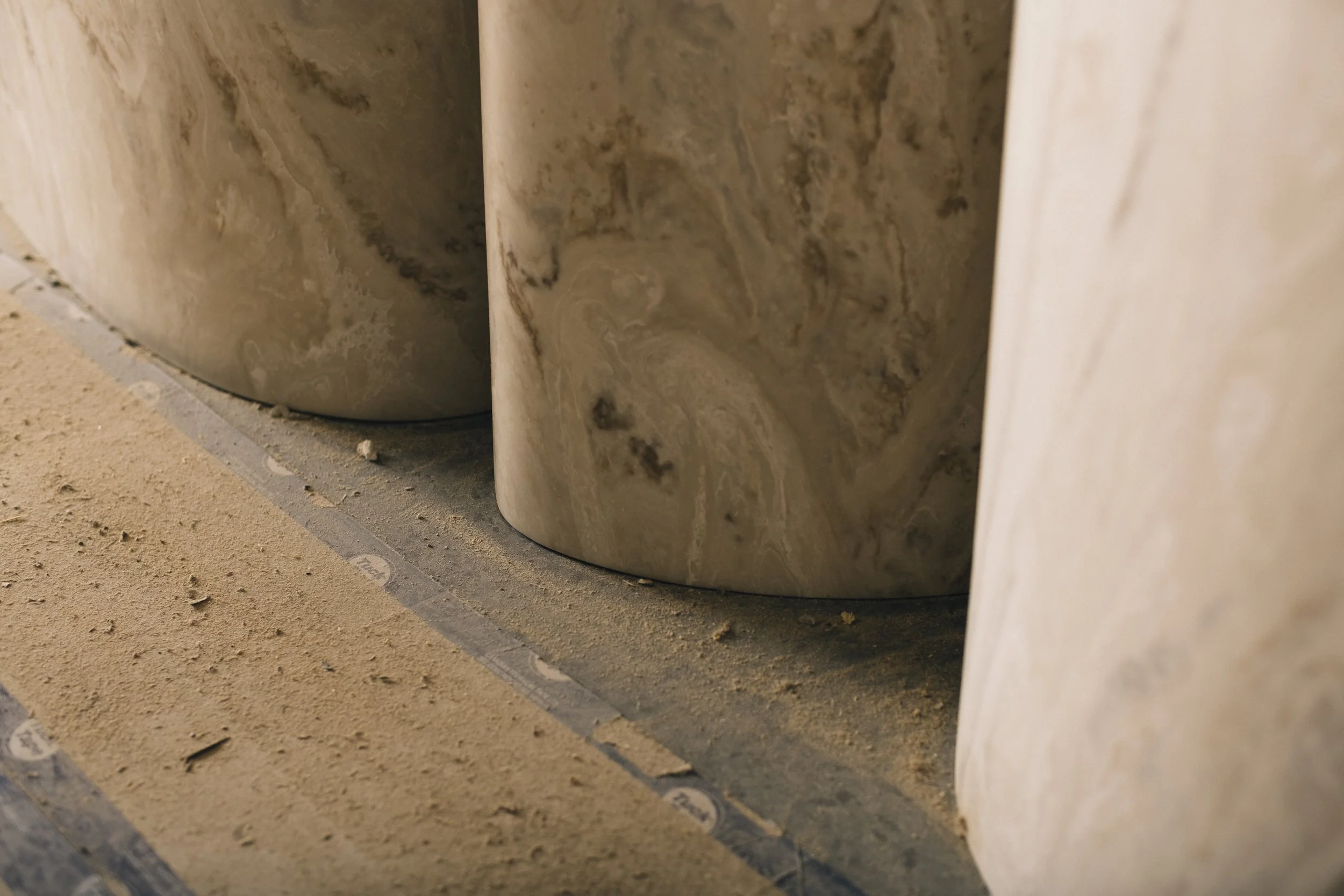Detail of minimalist, expressive curved forms of reception desk designed by Odami for The Drake Hotel