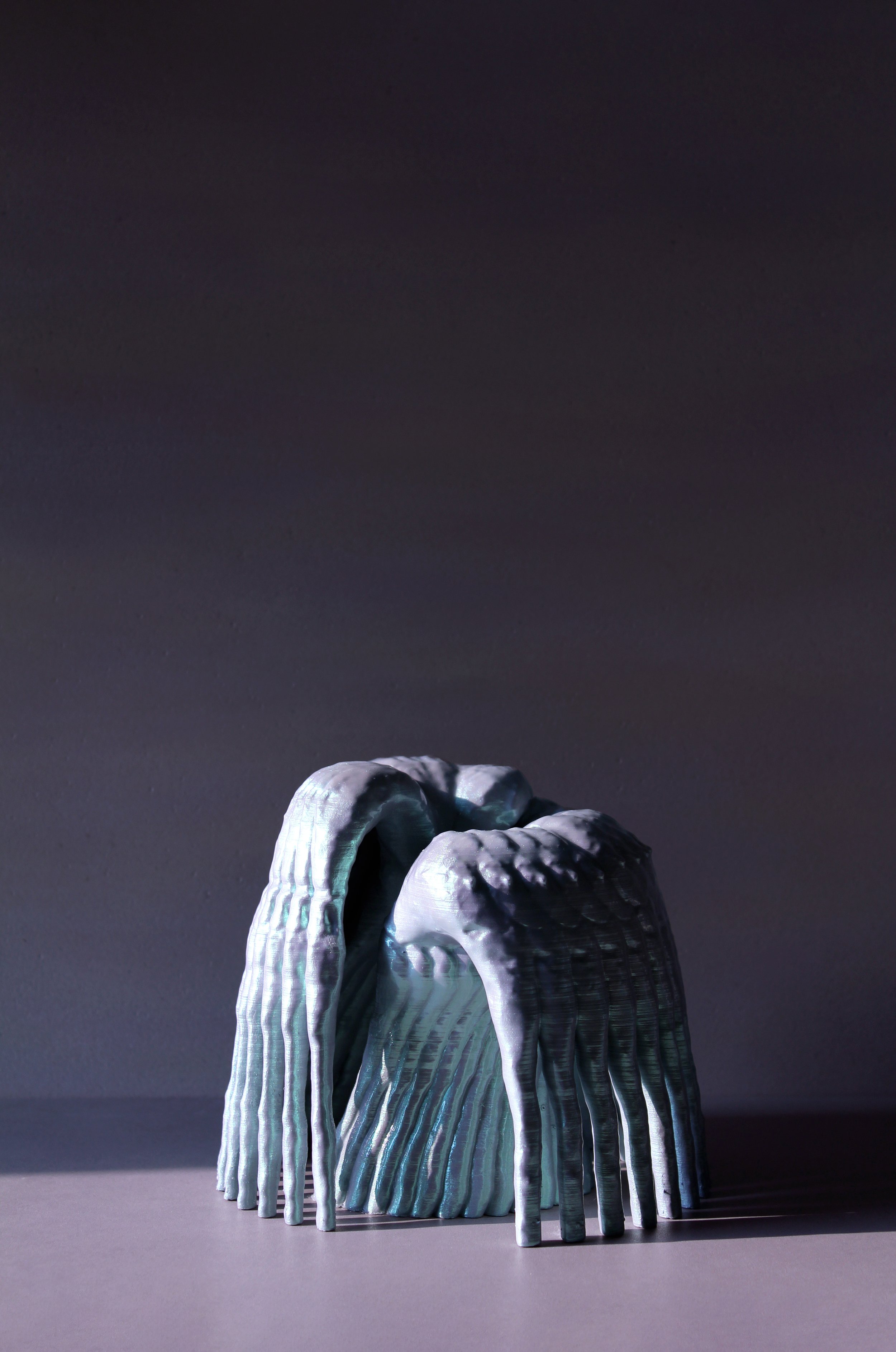 Glossy sculptural piece resembling intertwined limbs or wings, created through 3D scanning and printing for the Pet Objects domestic design series.