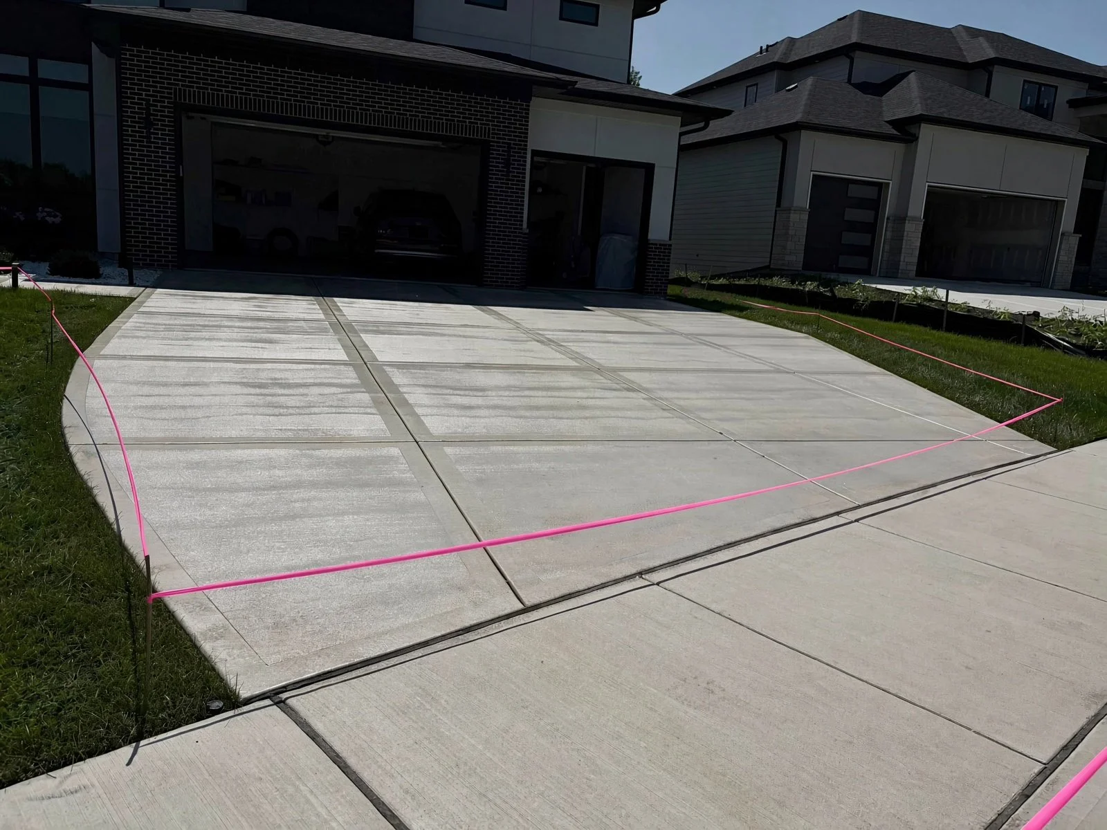 New concrete driveway. concrete sealer. pressure washing. driveway sealing. concrete driveway sealing. professional concrete sealing.