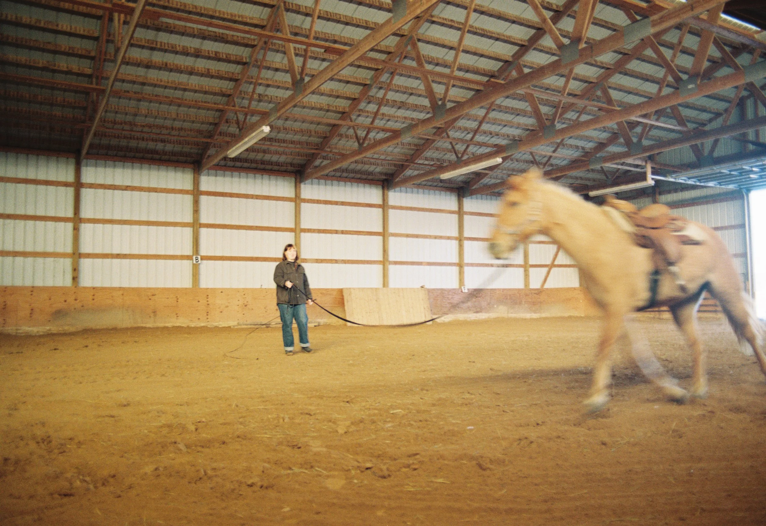 May Willison leads her horse, Dottie, around a farm in rural Octono County, Wisconsin on December 20, 2025.