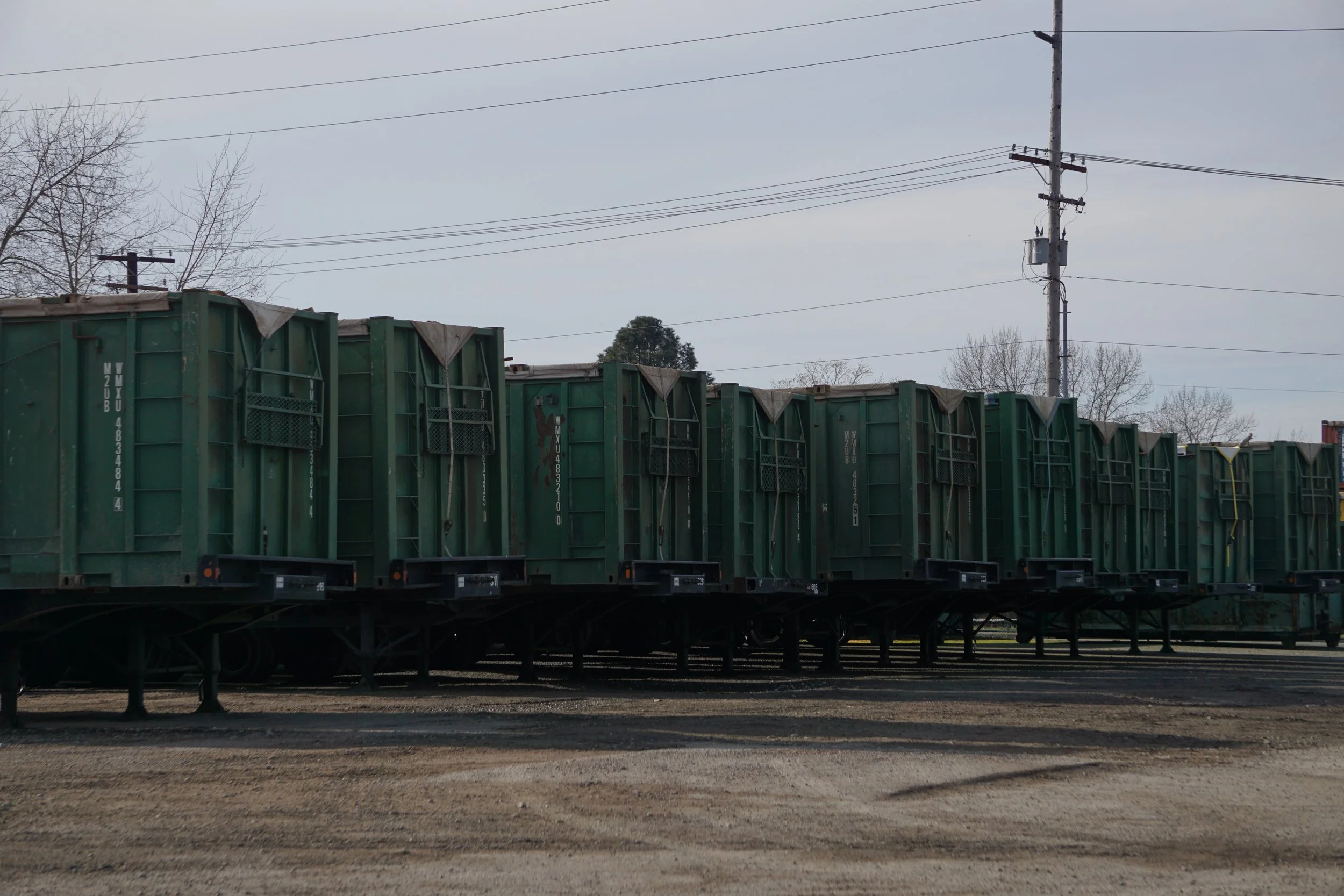  Intermodal containers are lined up with garbage at Recycling &amp; Disposal Services in Ferndale, Wash., on Feb. 6, 2026. Days after the rainfall stopped, materials were transported through the Stremler pop-up debris station, where they were later l