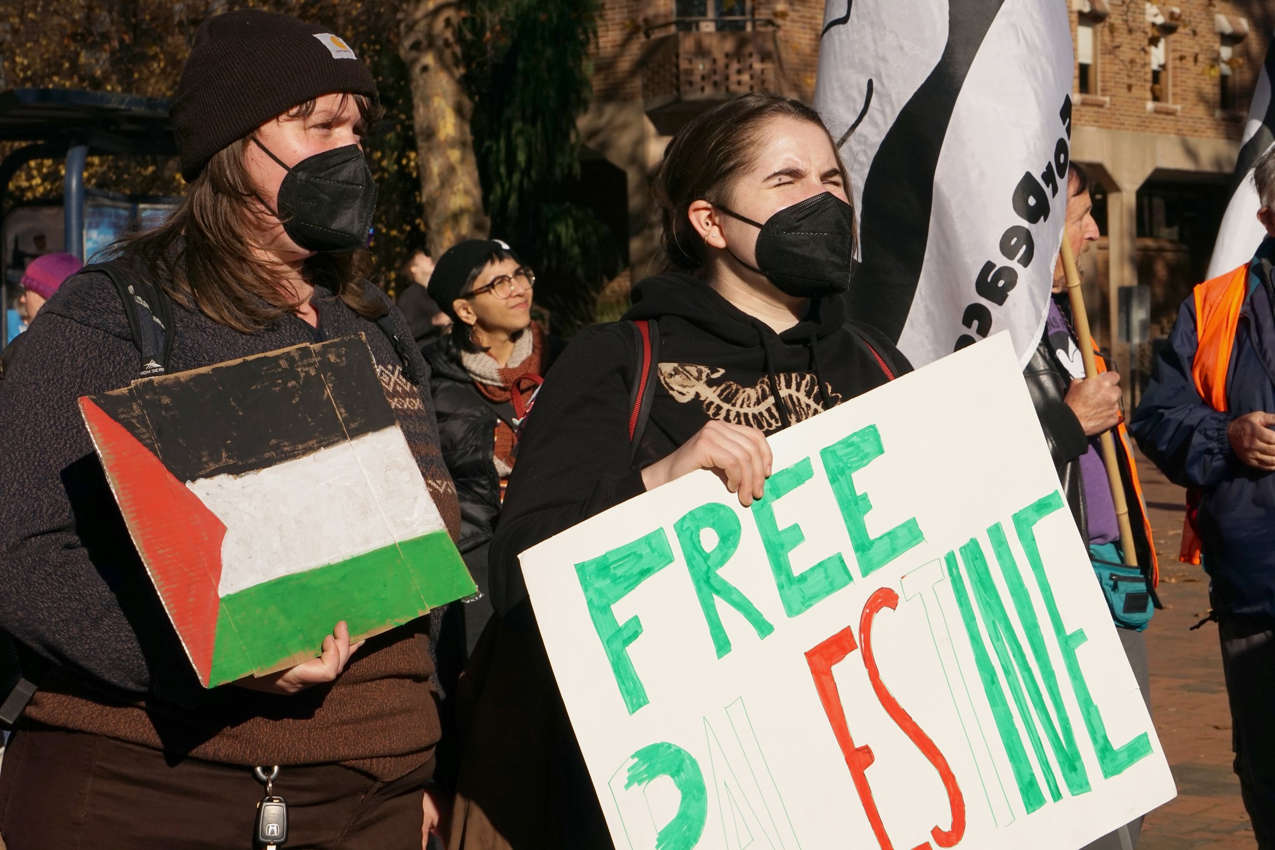 Two Western Washington University students hold signs for Palestine while chanting with the crowd during the Palestine protest at Red Square on campus in Bellingham, Wash., on Friday, Nov. 17, 2023. The protest said several chants, such as “Free Free