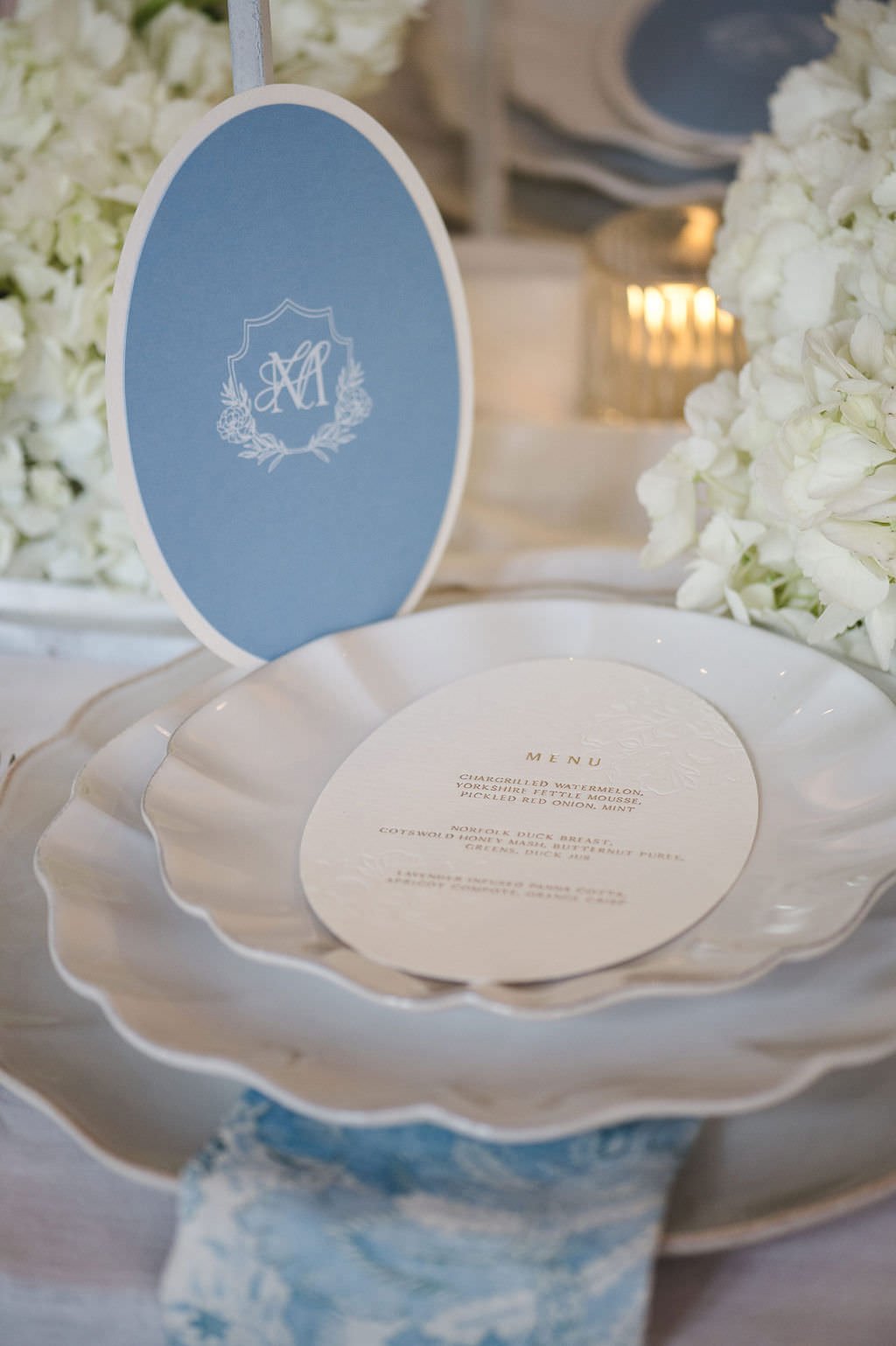 Lucca-Studios-Wedding-Stationery-Compton-Verney-Wedding-Nicola&Glen-Monogram-Oval-Menu-Blue.jpg