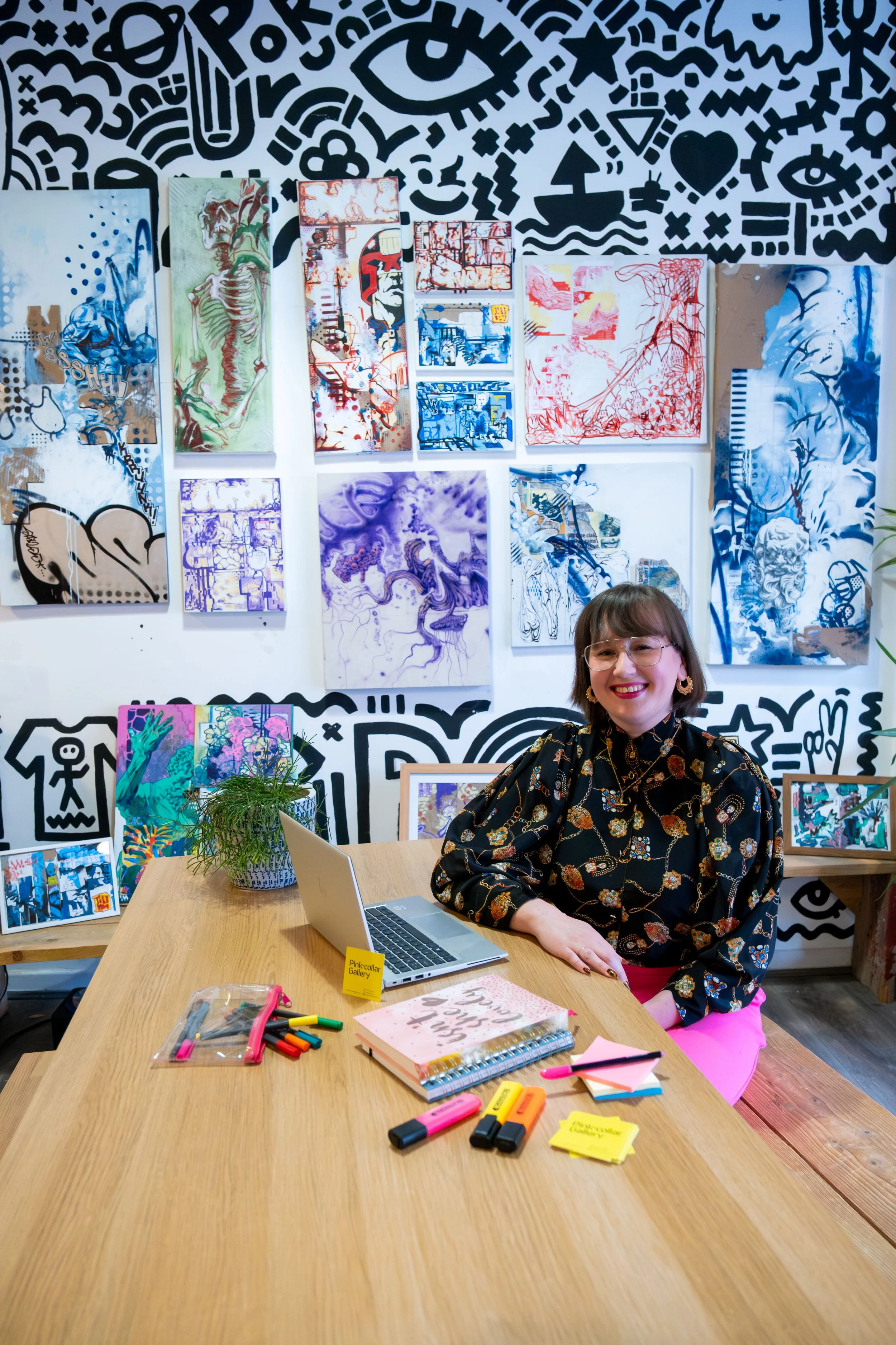 Gallery Owner Michaela of Pink Collar Gallery, portrait in her business environment