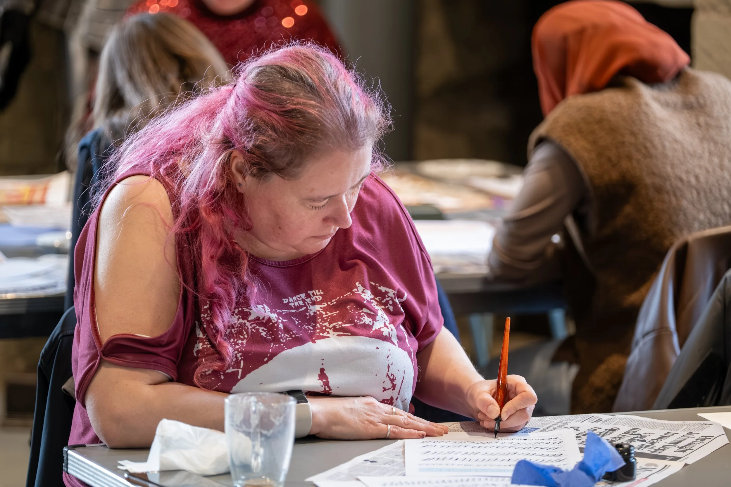 Natural documentary photograph from a community calligraphy workshop at Hylton Castle.