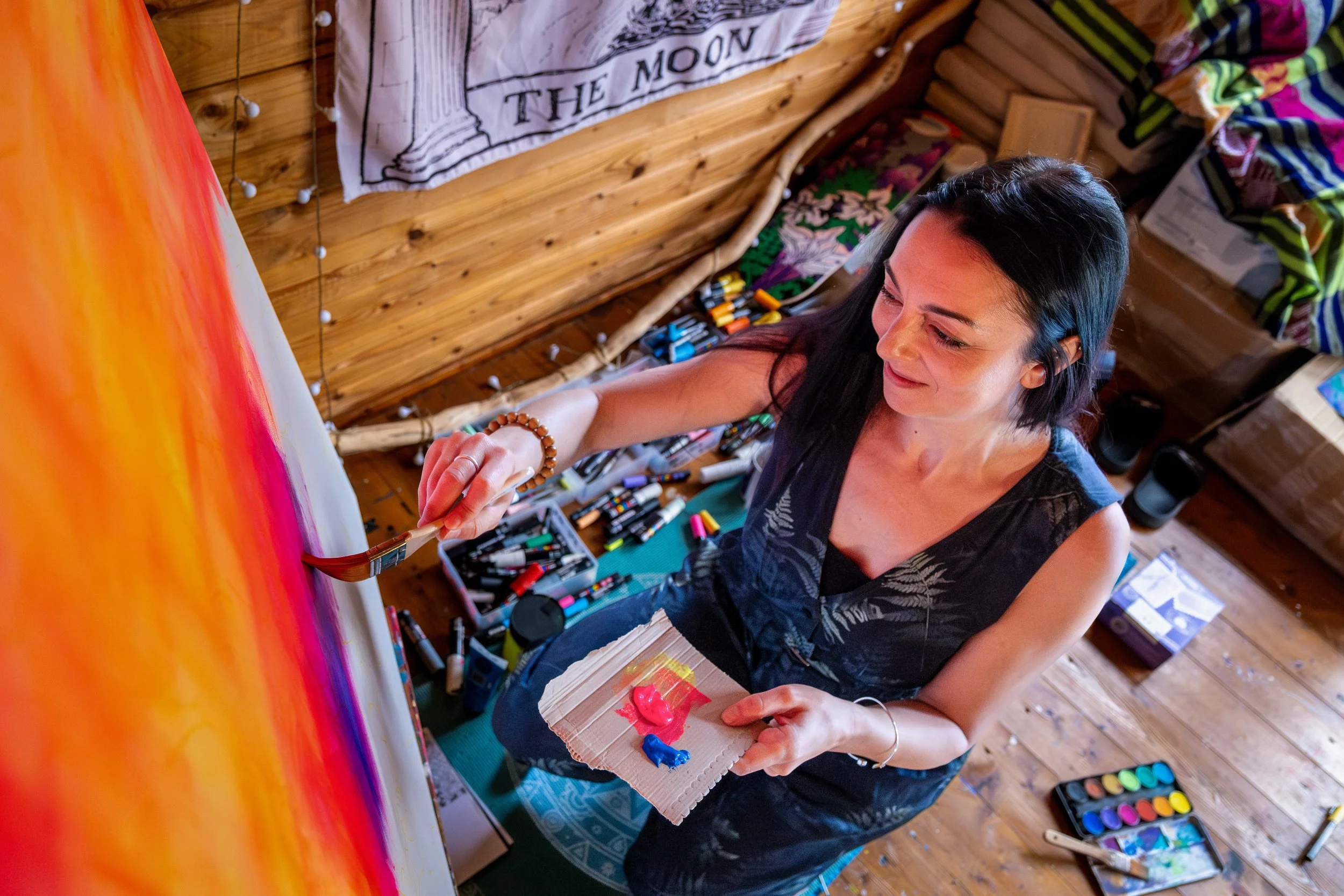 Documentary-style portrait of a Sunderland artist photographed within their working studio environment.
