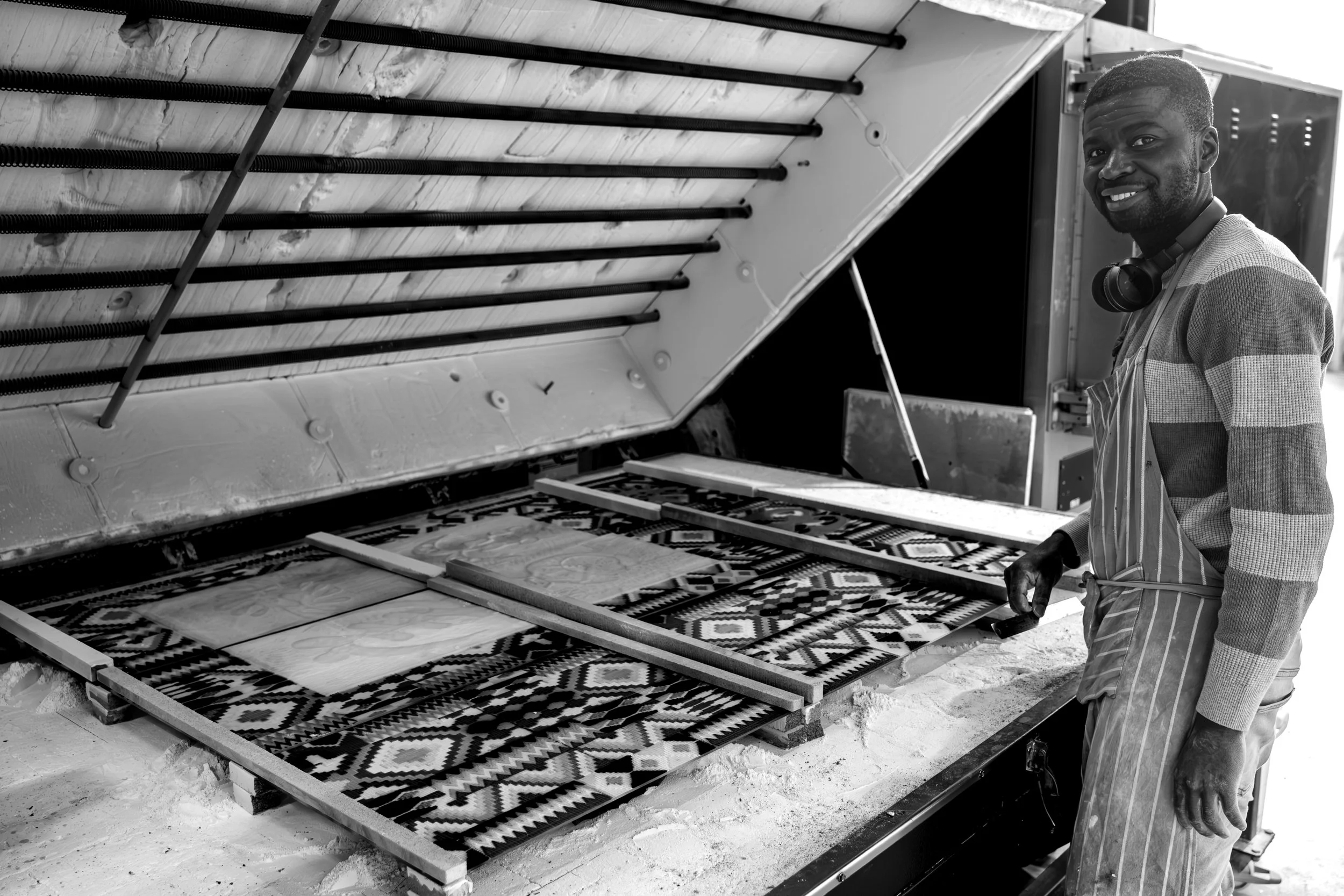 PHD Glass Artist working with powdered glass in his Studio in the North East.