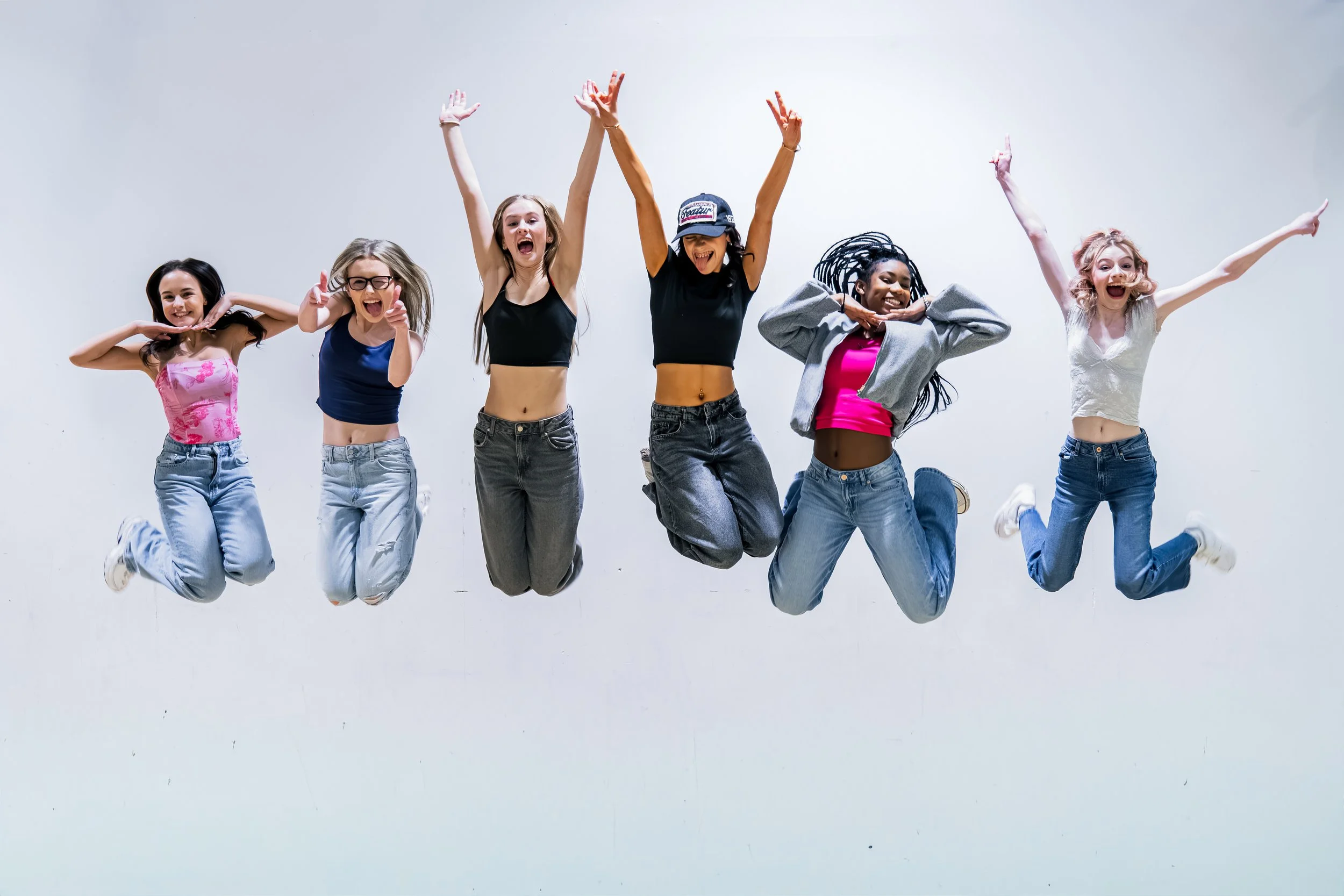 Portrait photography for Northern Daughters Album cover at Inspire Stage school Sunderland, girls jumping in the air excitedly