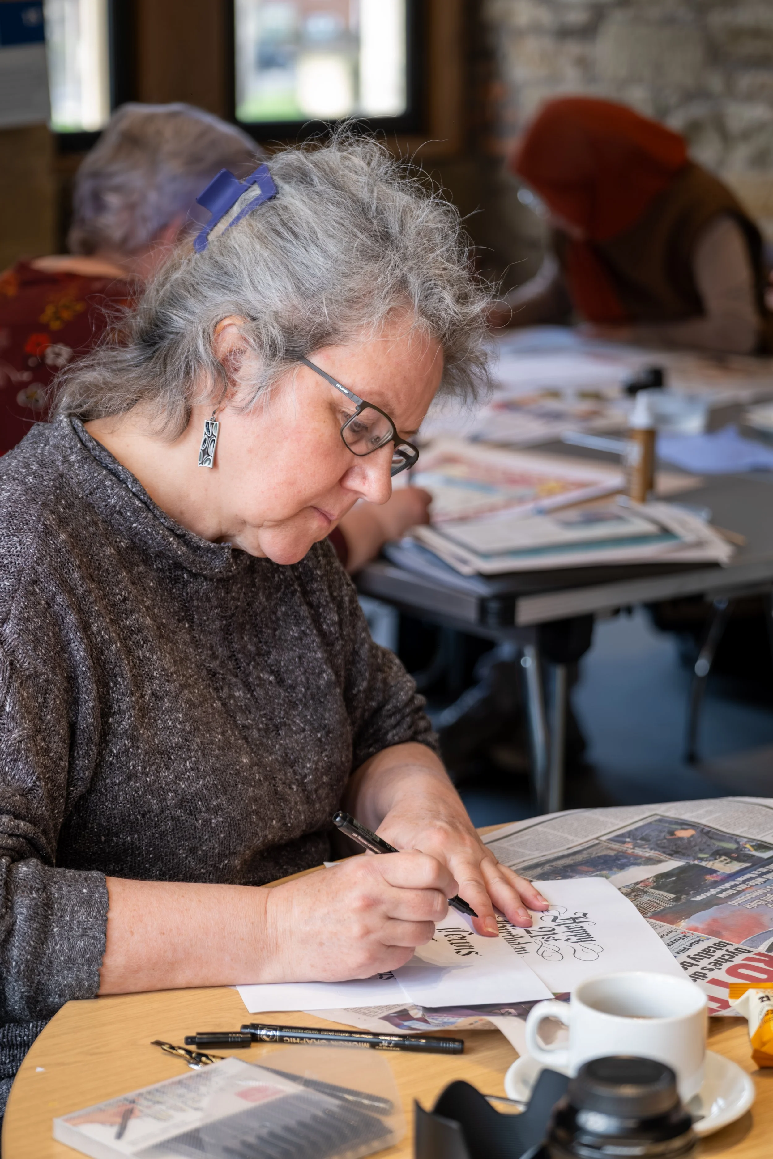 Documentary photograph of a calligraphy workshop for Pink Collar Gallery at Hylton Castle, Sunderland.