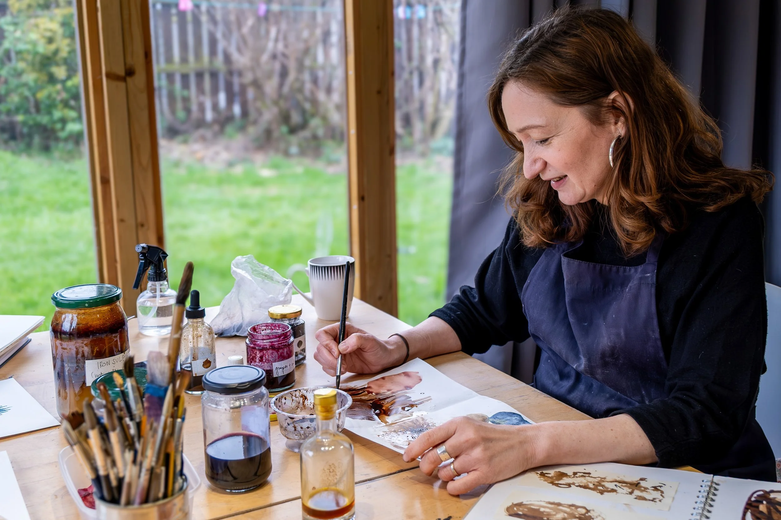 Environmental portrait of an artist at work in their creative studio in Sunderland, North East England.