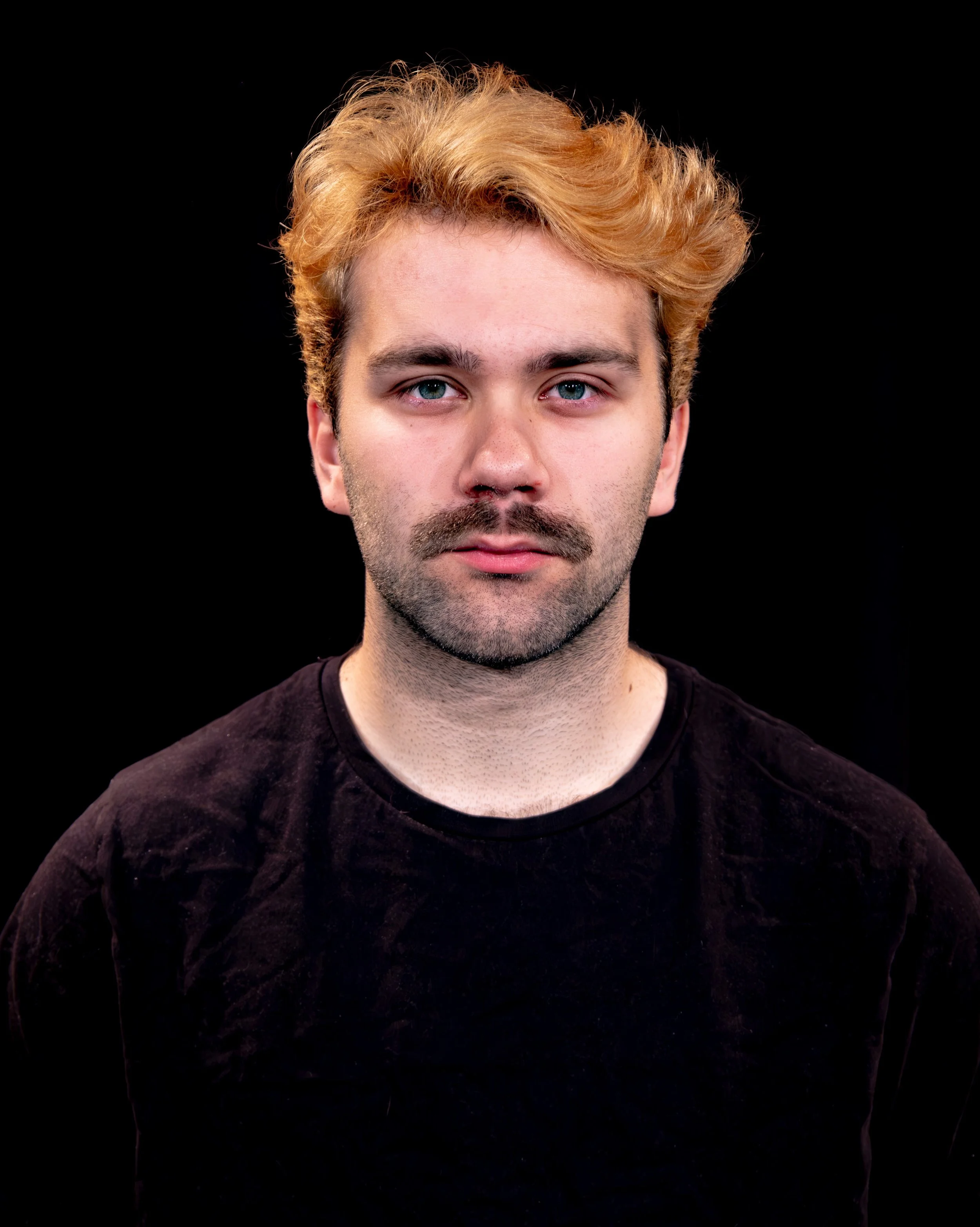 Studio headshot for an acting student in performing arts.
