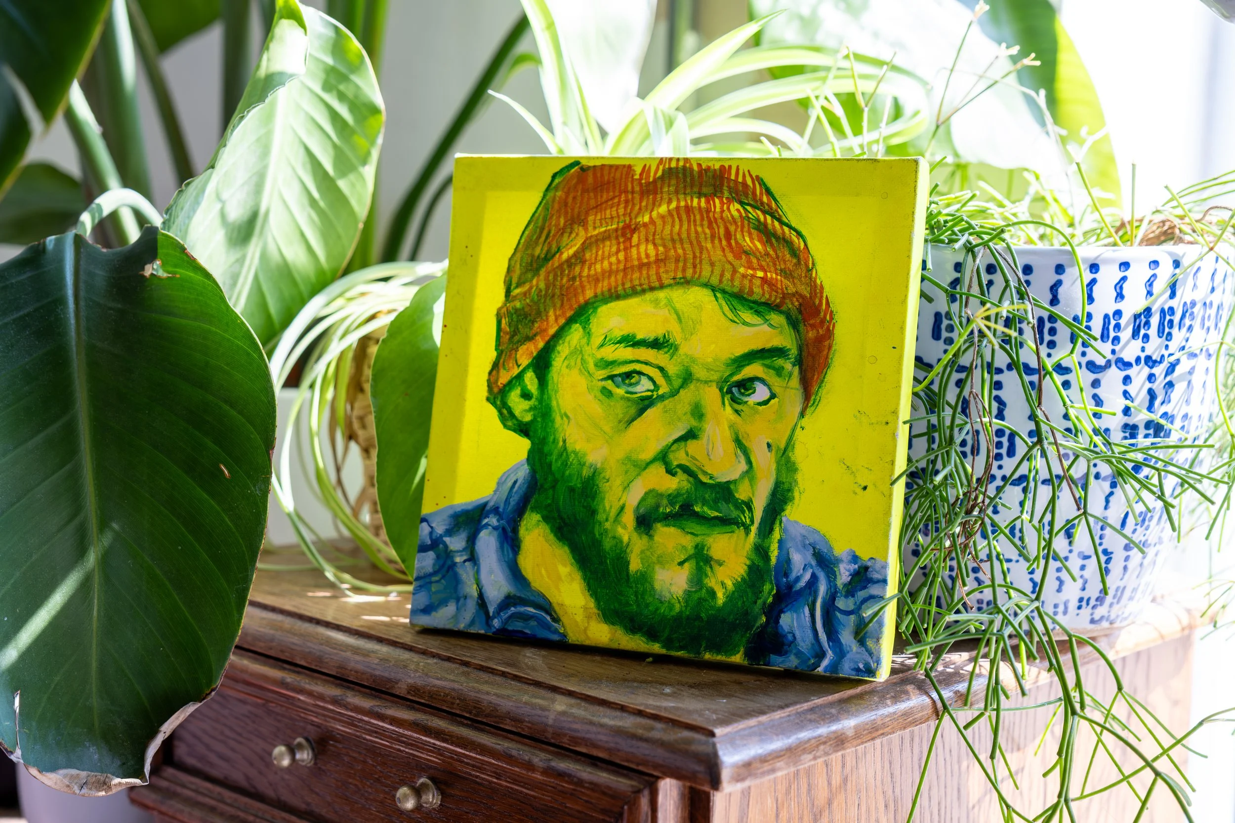 Original painting photographed on display within its exhibition environment.
