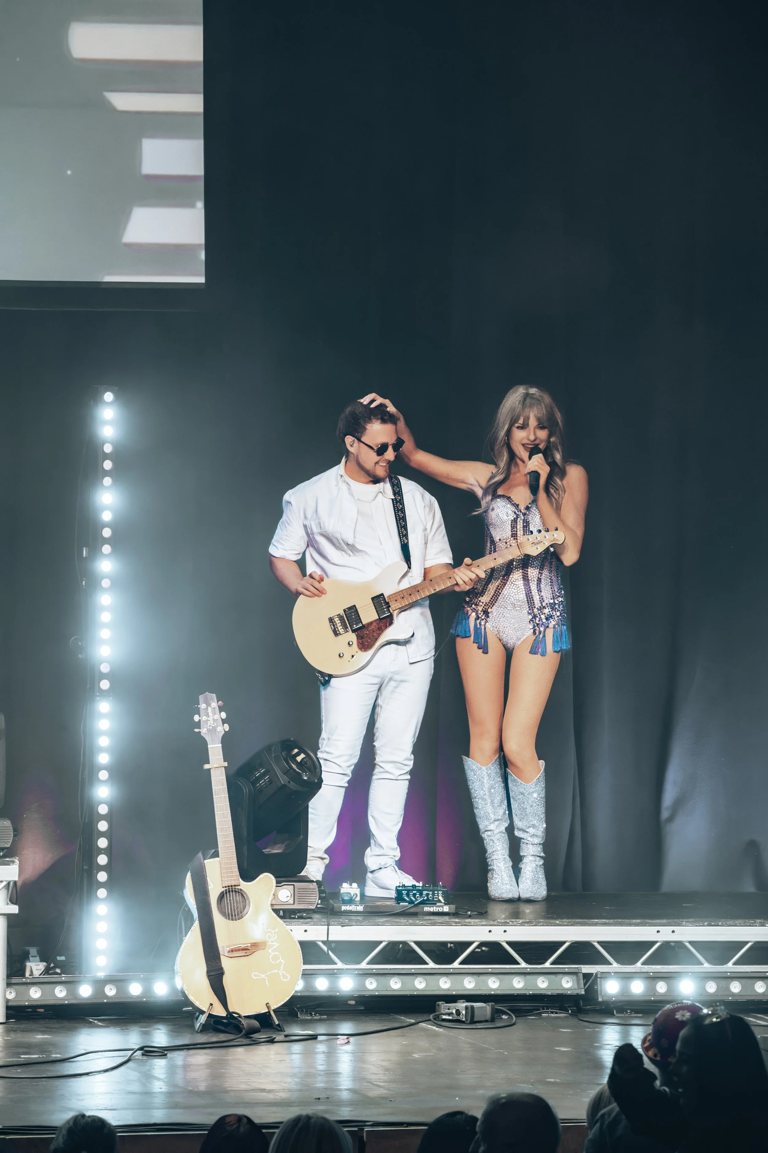 taylor swift on stage at the fire station