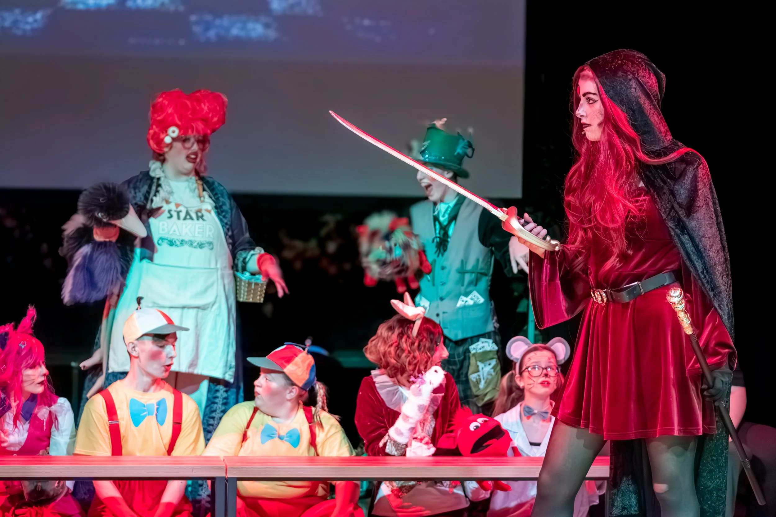 Cast performing during an Alice in Wonderland theatre production in Sunderland.