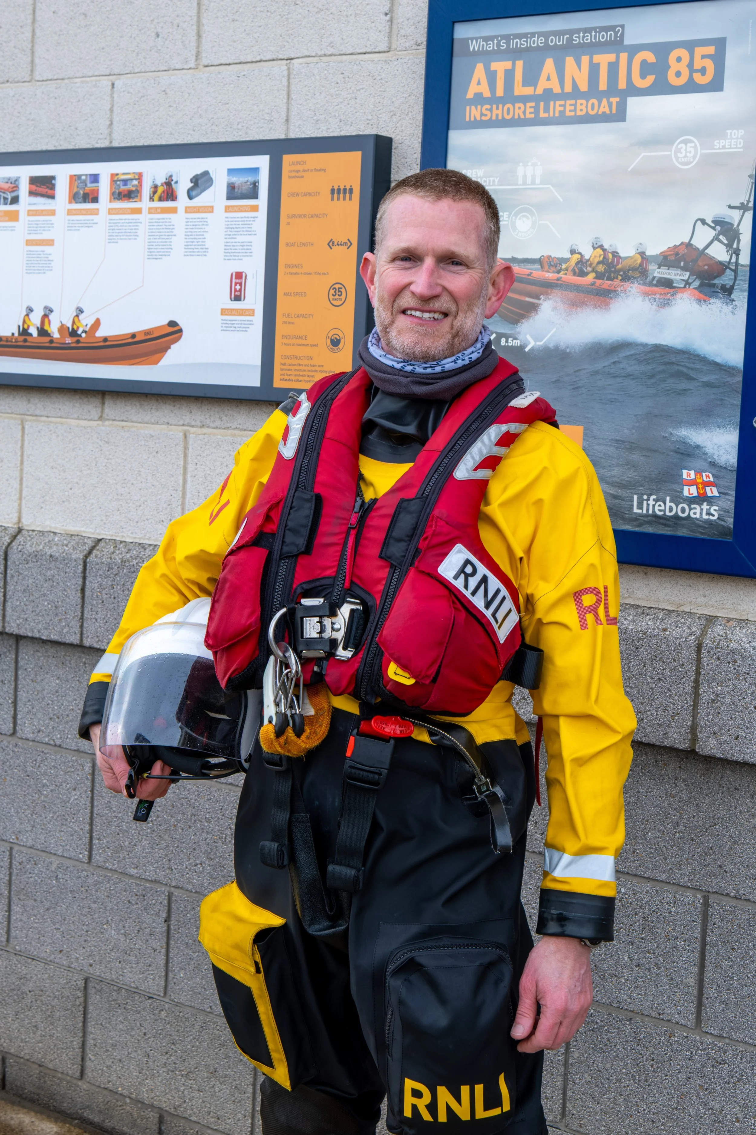 Outside Sunderland lifeboat station, a volunteer in uniform.