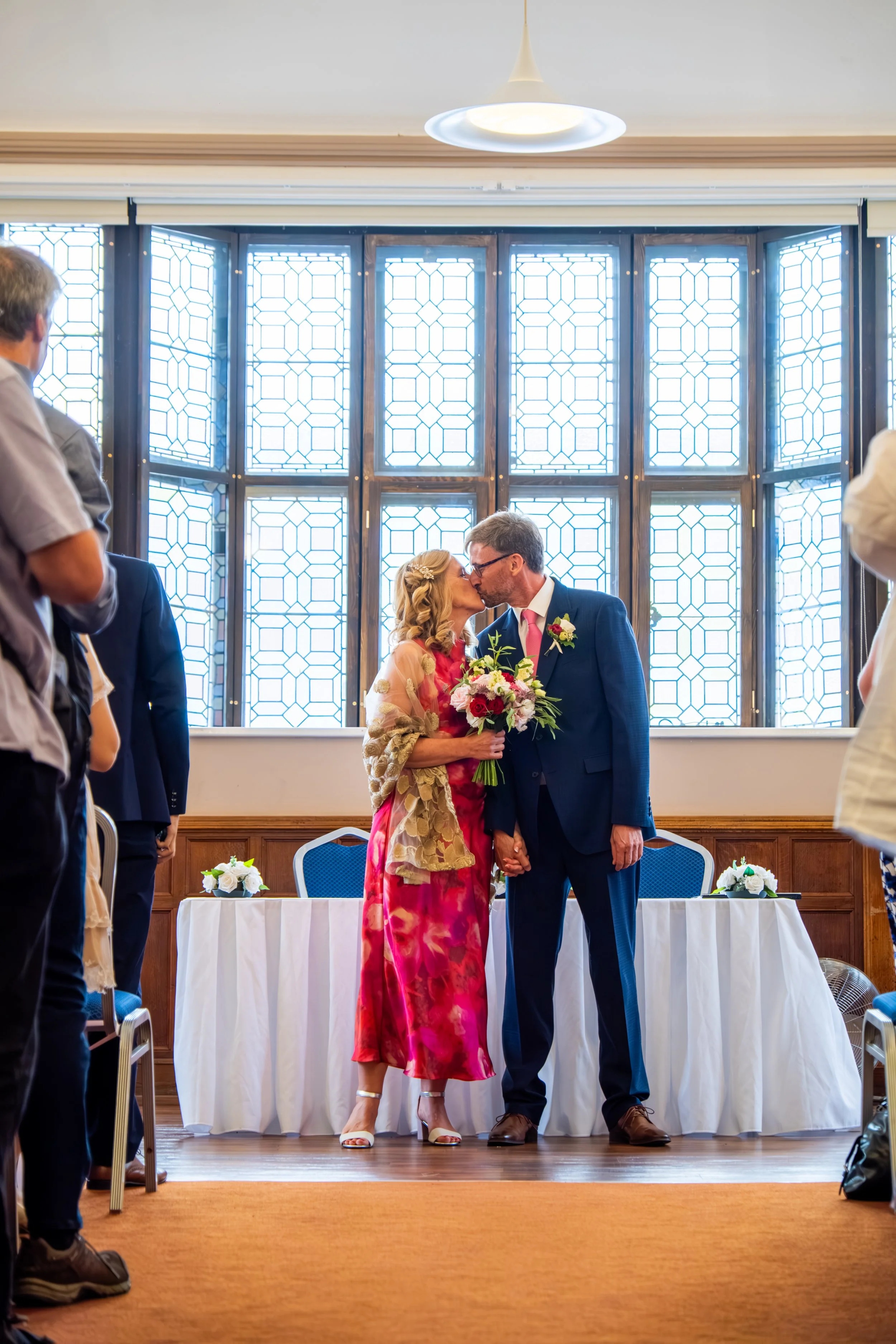 Relaxed documentary photograph of a couple celebrating their wedding in North East England.