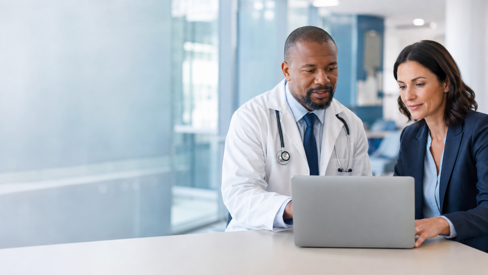 Healthcare professional working on a laptop