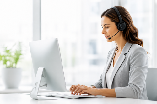 Remote medical administrator working at a computer