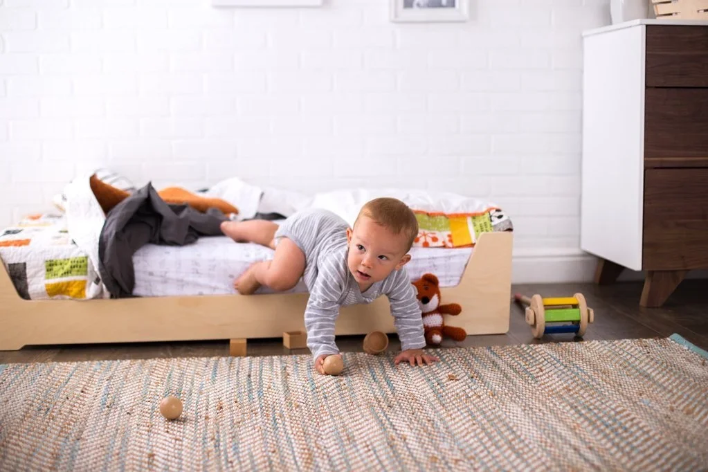 Child using montessori floor bed