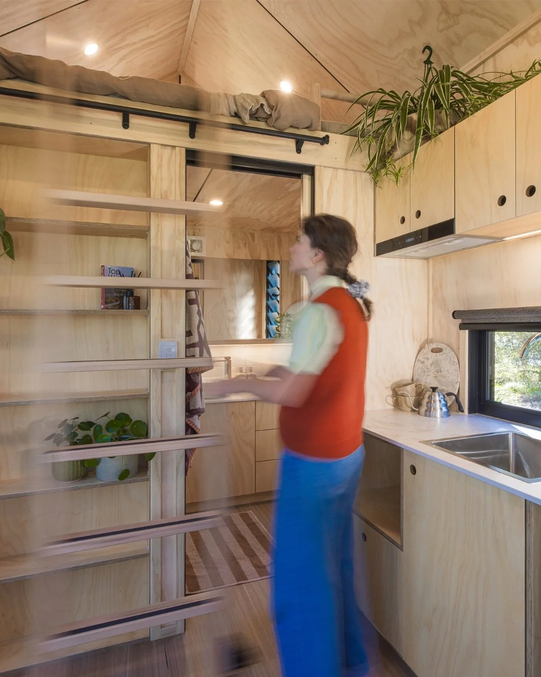 A sliding ladder in the Five Four gives easy access to the loft by positioning it beneath the pitch of the roof for maximum head height. It slides away to keep the bookshelf and bathroom door fully functional. A simple idea, cleverly executed.

#tiny
