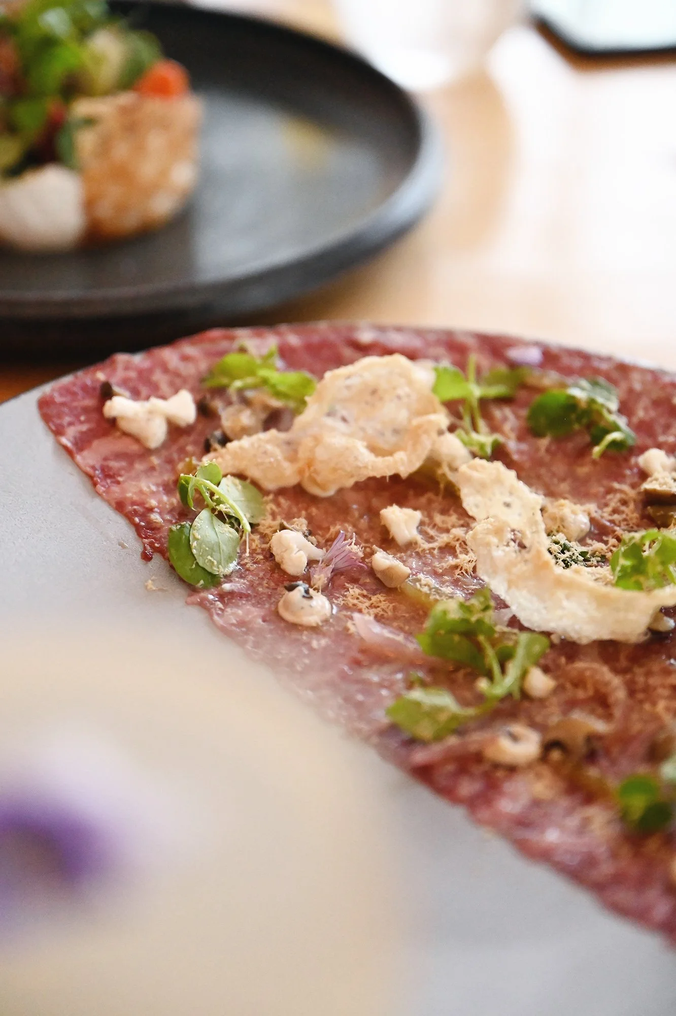 Close up shot highlighting the artistry of the food styling at a restaurant.