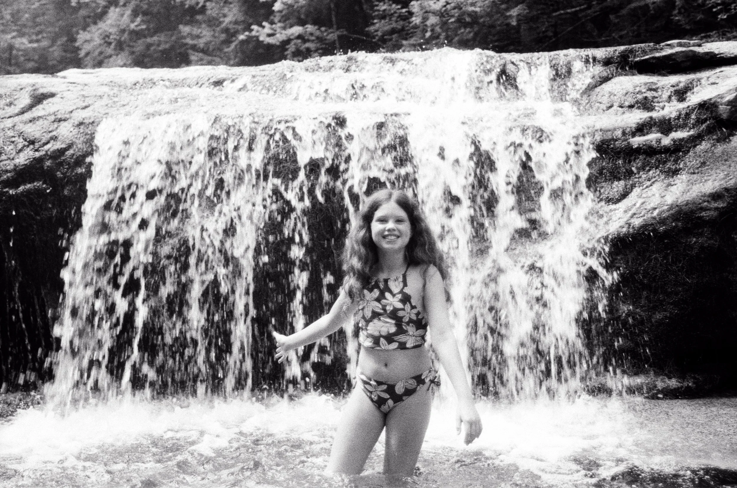 Toni smiling in waterfall.jpg