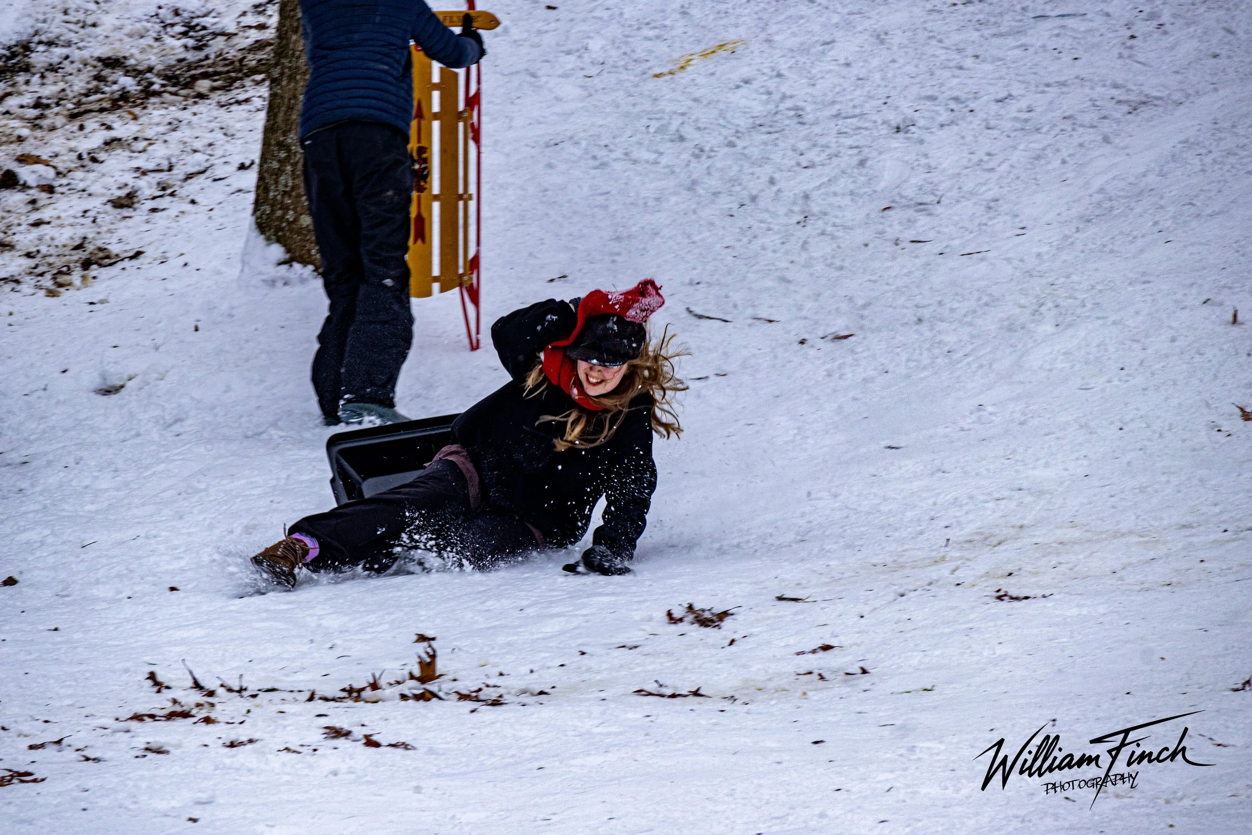 Girl in Red Scarf Sledding.jpg