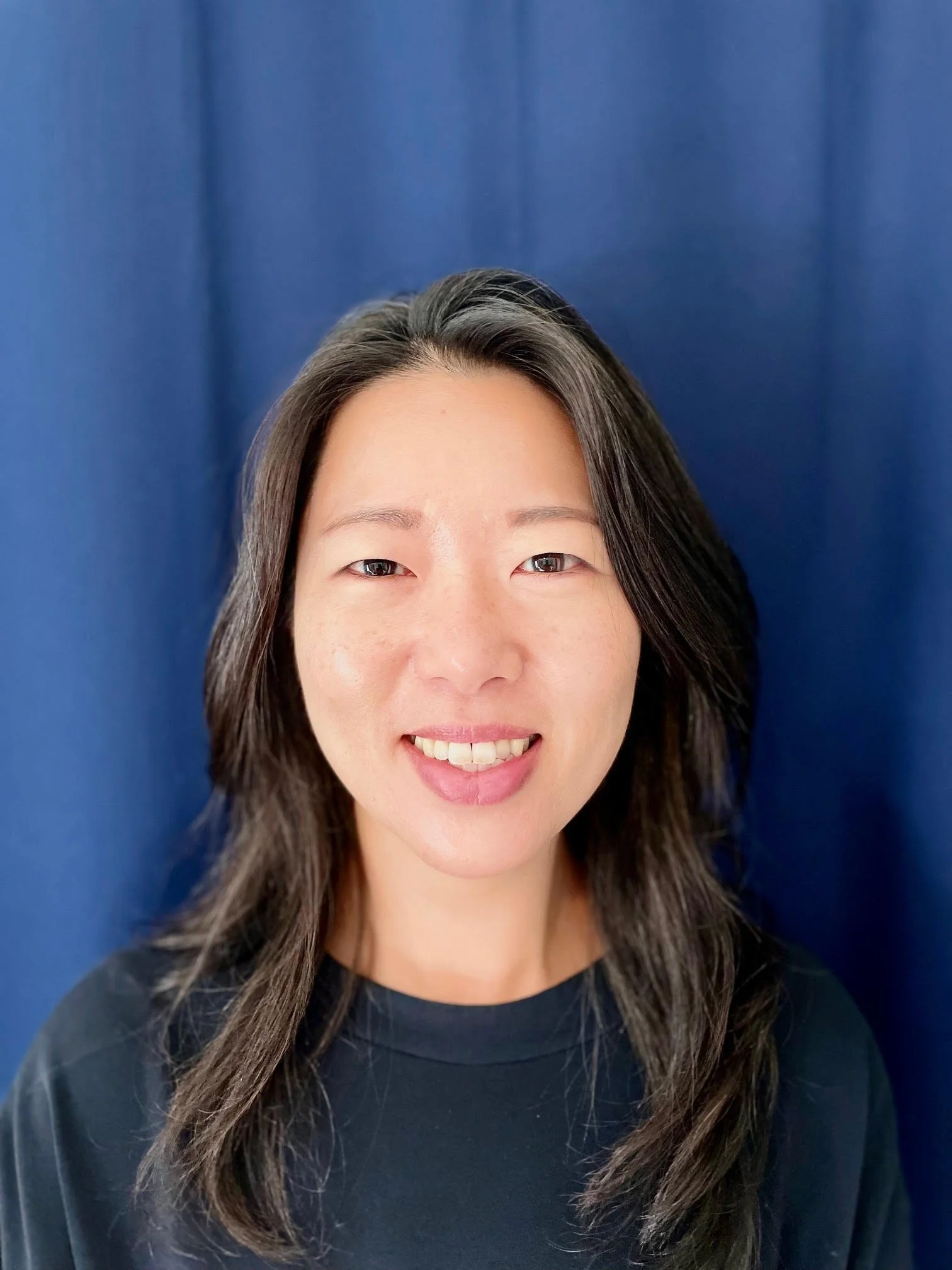 headshot of Weonhee Shin