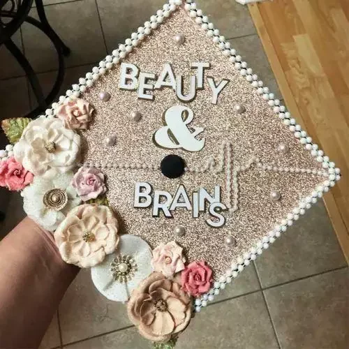 graduation-cap-gold-pearls-flowers-beauty-brains-500x500.webp