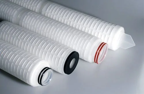 Close-up of four water filter cartridges with different colored seals.
